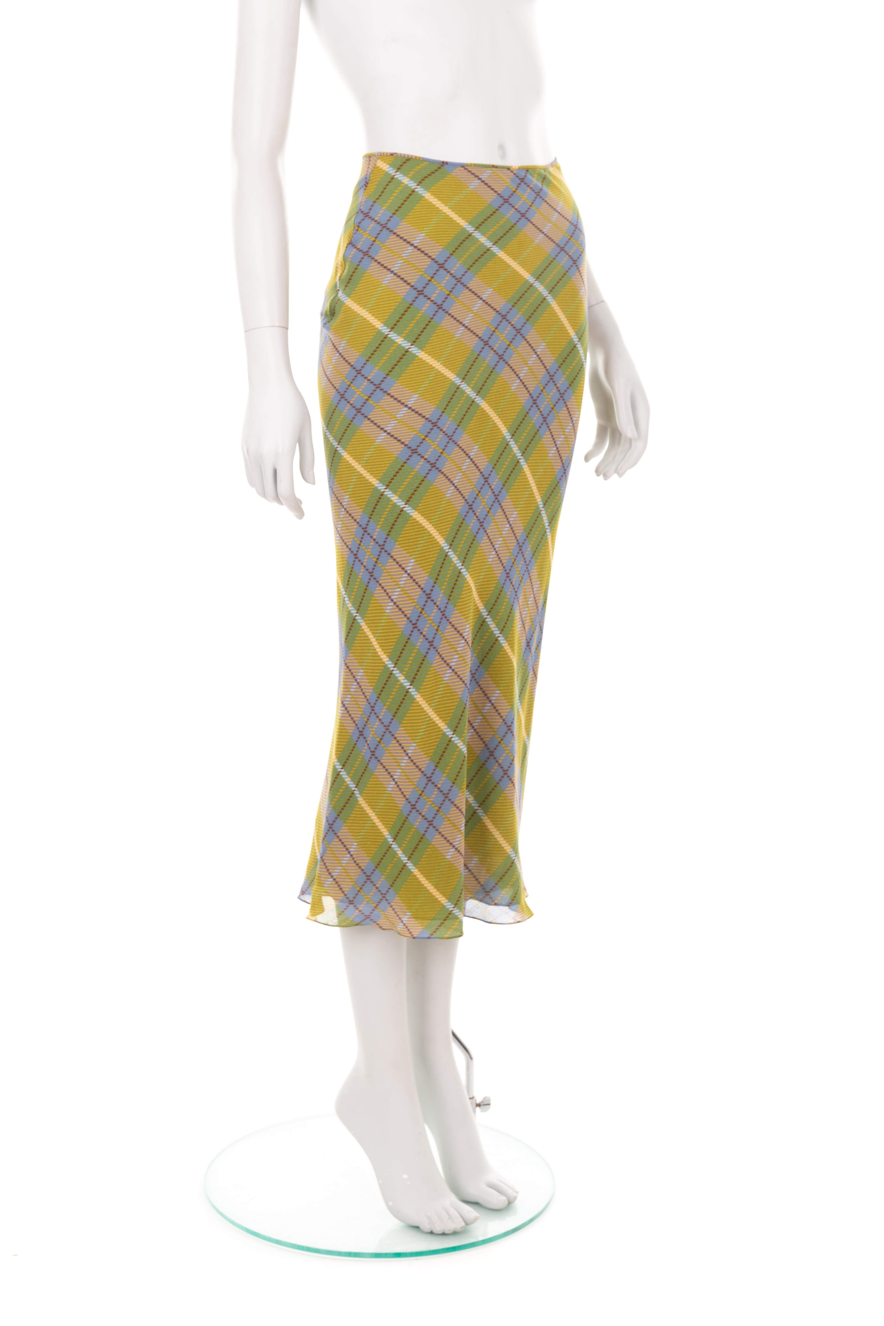 - John Galliano Fall Winter 2000 collection
- Sold by Gold Palms Vintage
- Silk midi skirt
- Bias cut
- Ochre, blue, white check motif
- Side button-up fastening
- Size: UK 8 - US 2

Waist (flat): 31 cm/ 12,2 inch
Hips (flat): 36 cm/ 14,1