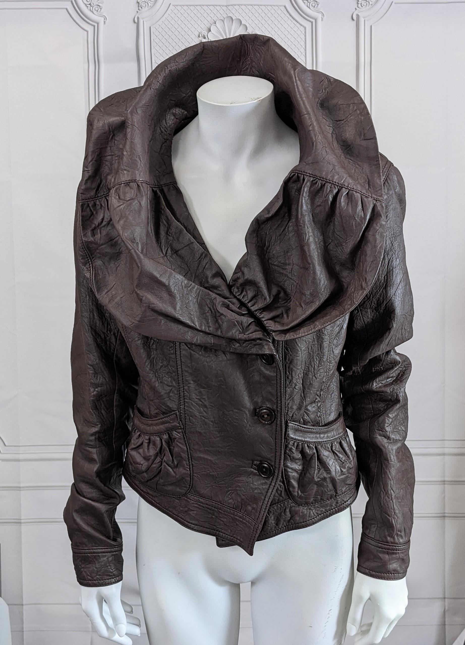John Galliano Fall/Winter 2005 portrait collar cropped leather jacket of distressed and gently wrinkled sheeps skin coffee brown leather. Dramatic draped portrait collar that came be laid flat or pulled open, closing with side button closures.