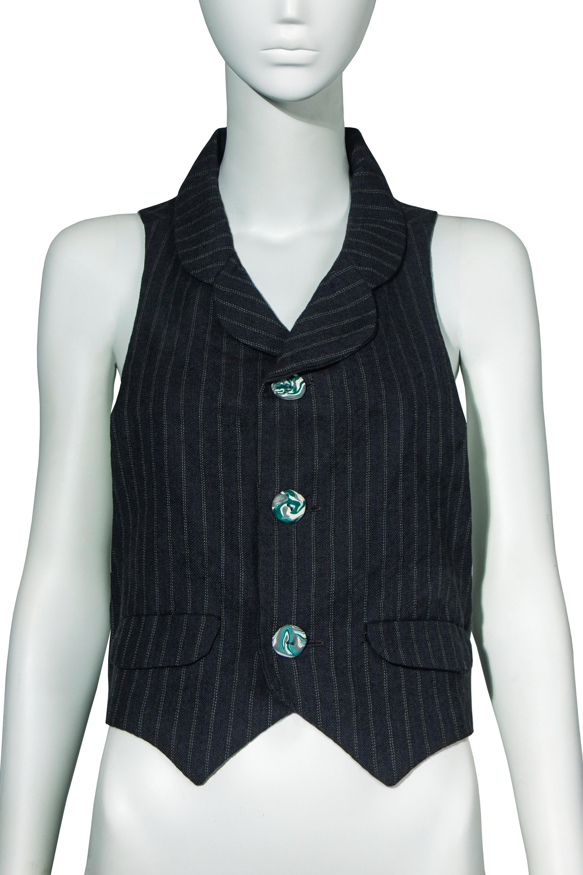 A John Galliano pinstripe vest, spring-summer 1986 'Fallen Angels'. This incredibly rare and early garment is from Galliano's second runway show—his fourth collection. Featuring a rounded collar and mini lapel, the standout feature of this vest is