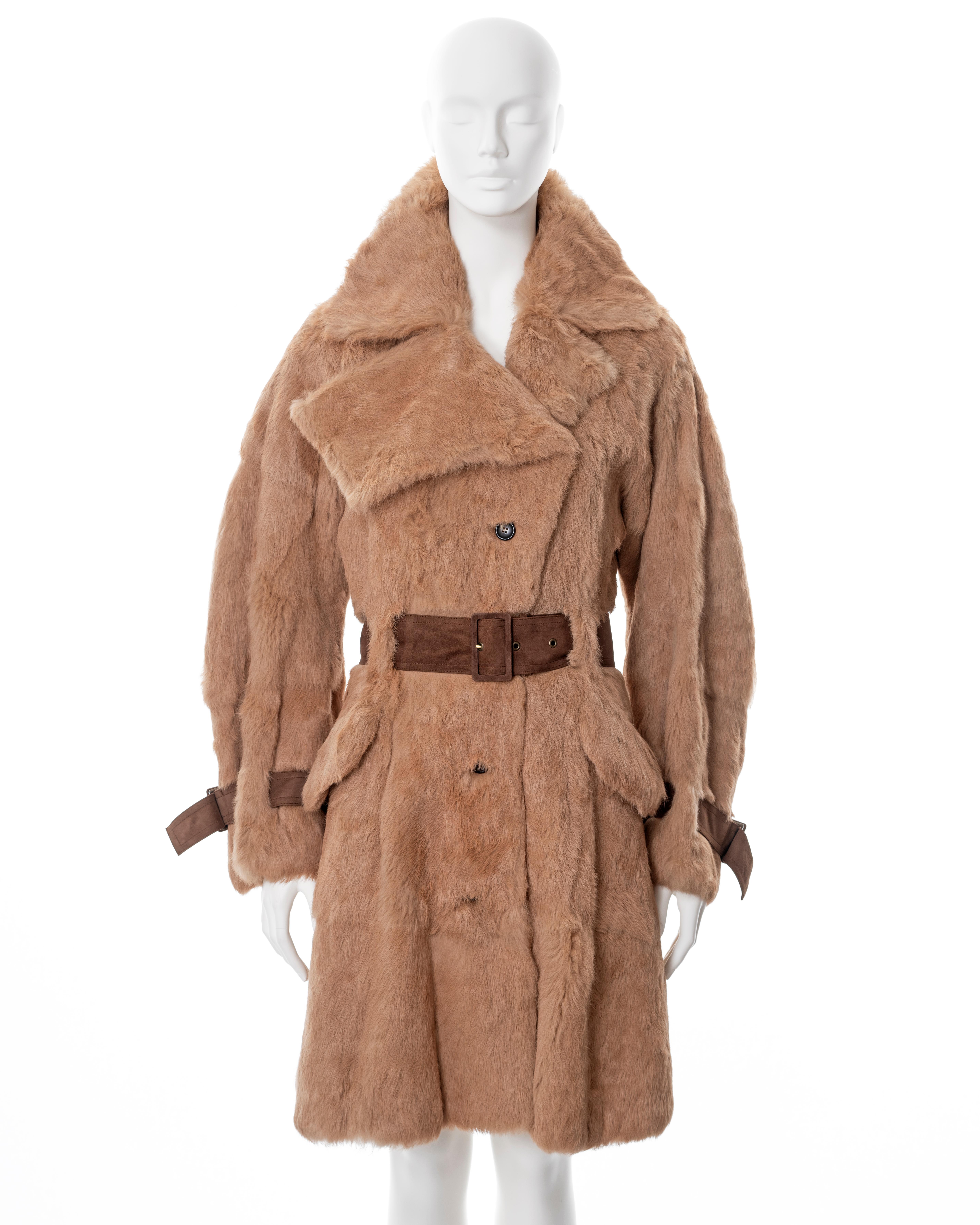 ▪ John Galliano fur trench coat
▪ Sold by One of a Kind Archive
▪ Fall-Winter 2003
▪ Constructed from fawn coloured rabbit fur 
▪ Brown suede belt and buckles 
▪ Front button closure 
▪ Wide curved sleeves 
▪ 2 front flap pocket 
▪ FR 36 - UK 8 - IT
