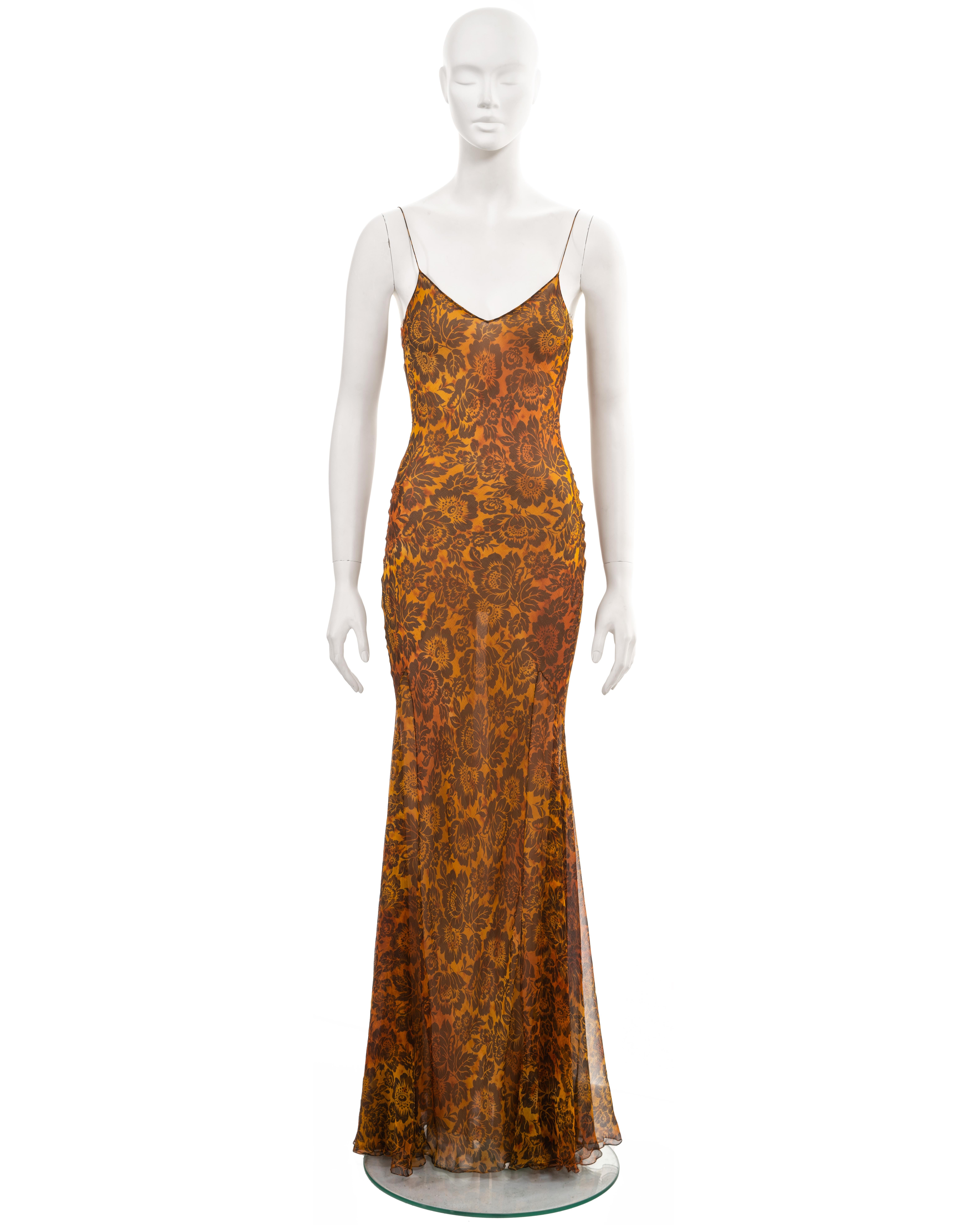 ▪ John Galliano archive evening dress
▪ Sold by One of a Kind Archive
▪ Spring-Summer 1999
▪ Tea-stained bias-cut silk with allover floral motif in burnt orange and brown 
▪ Nude lining 
▪ V-neck 
▪ Spaghetti straps 
▪ Floor-length skirt 
▪ 100%