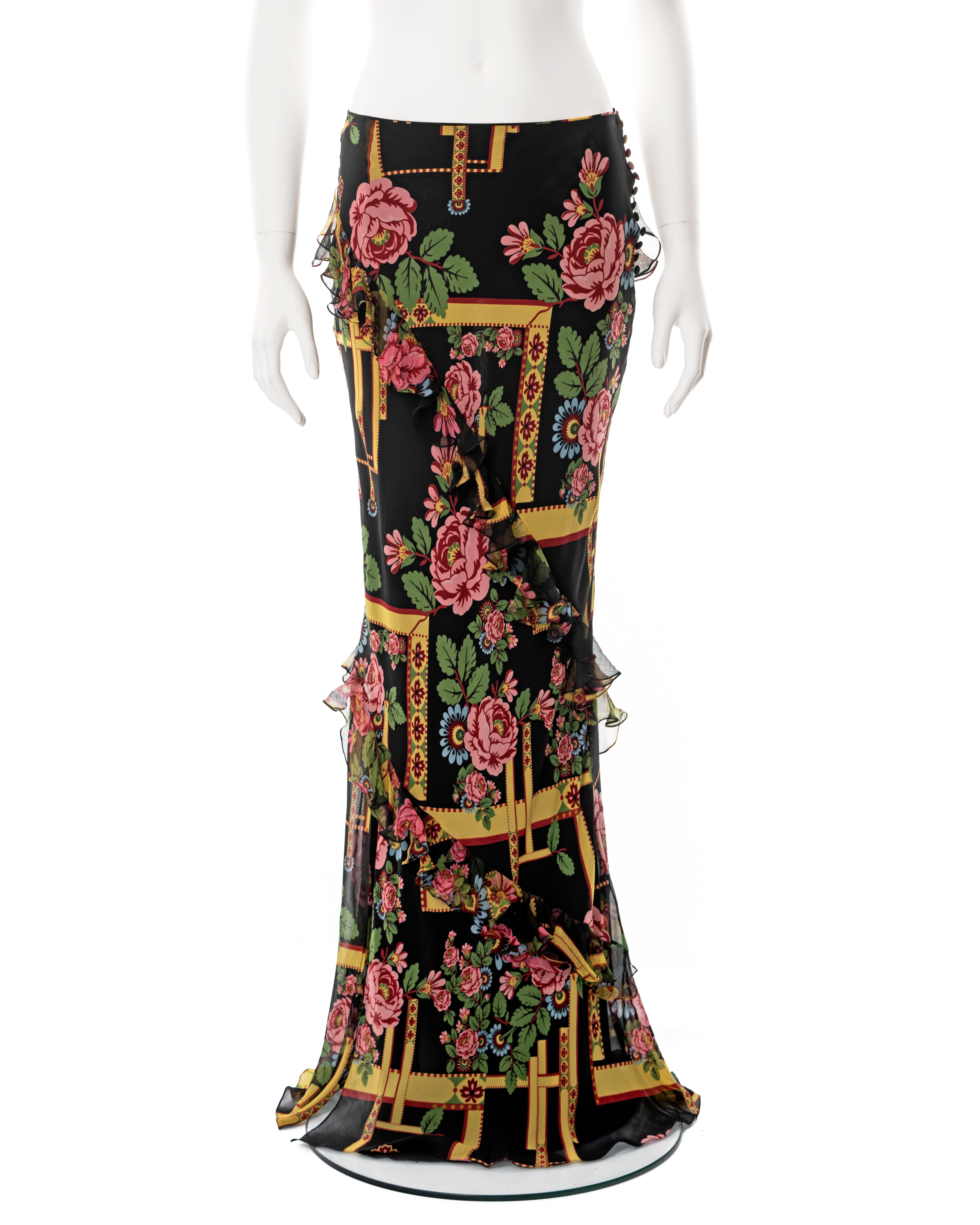 ▪ John Galliano bias-cut silk maxi skirt
▪ Sold by One of a Kind Archive
▪ Fall-Winter 2004
▪ Constructed from a floral printed silk with black base with pink, yellow and green motif 
▪ Silk chiffon frill trim outline bias-cut panels
▪ Multiple