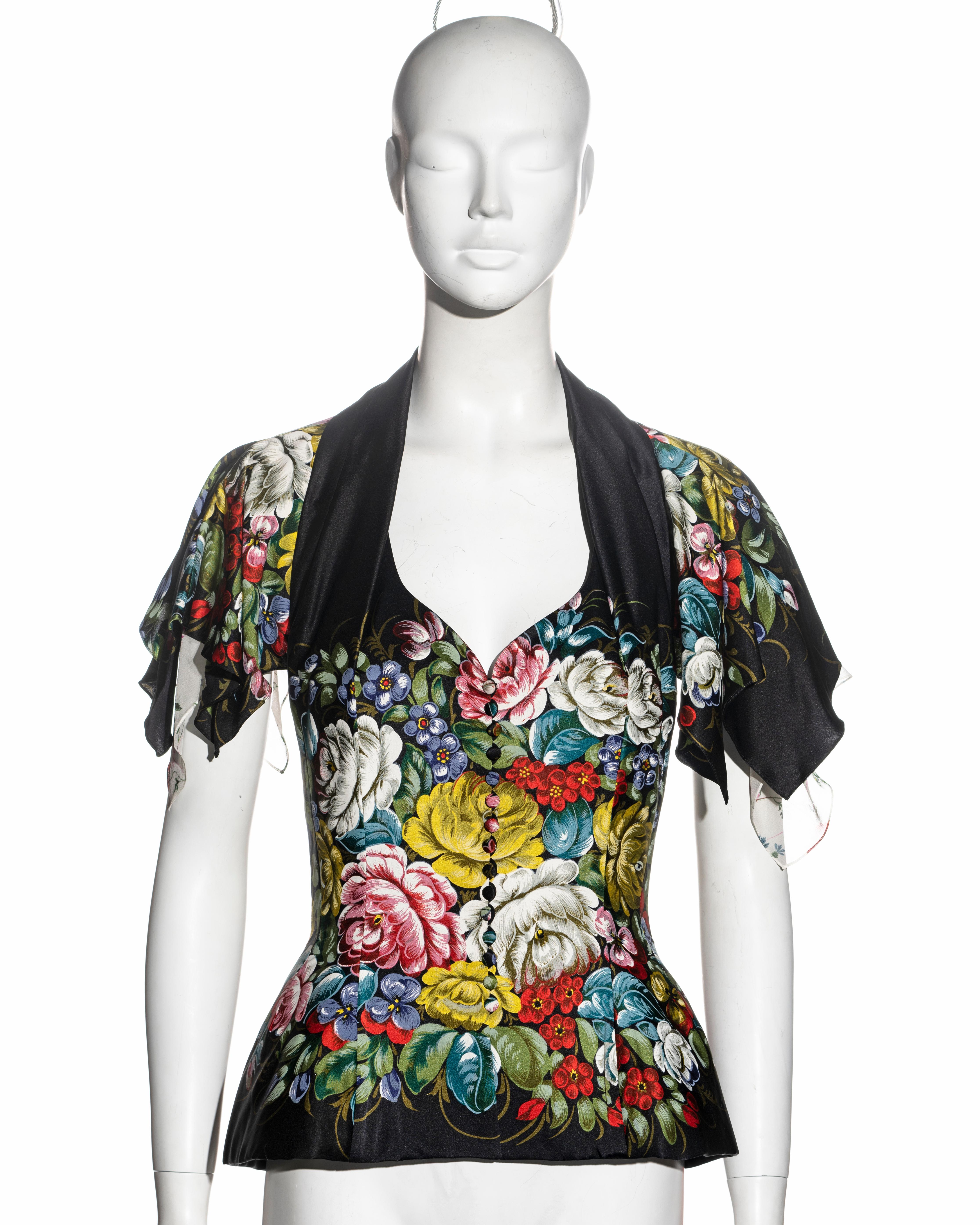 ▪ John Galliano structured sleeveless jacket 
▪ Fine black silk with Zhostovo-style floral print 
▪ Halterneck lapel 
▪ Accentuated padded hips 
▪ Double-layered handkerchief collar falls over the shoulders with a white floral silk chiffon underlay