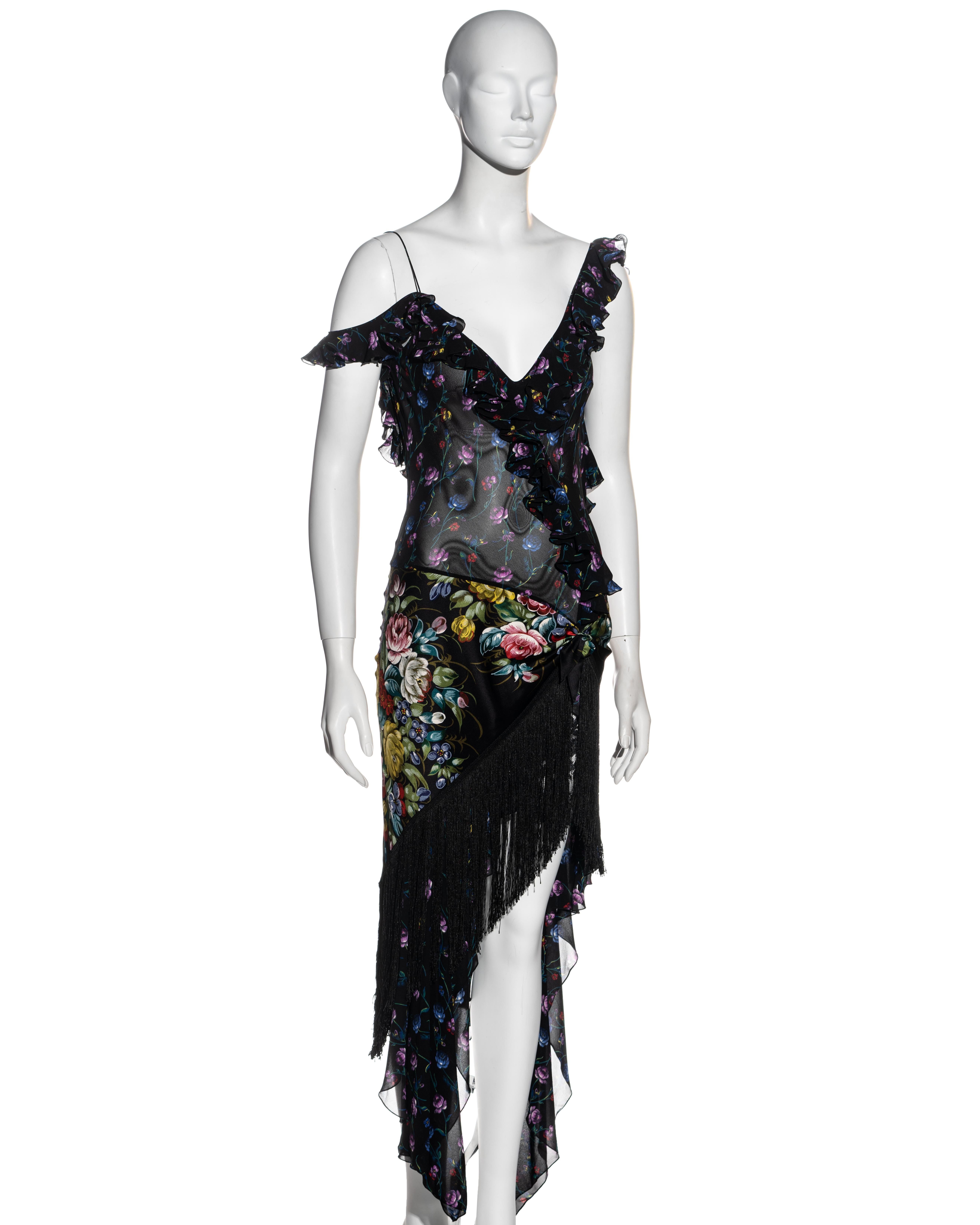 ▪ John Galliano floral silk chiffon evening dress
▪ Blue, purple, yellow and red floral print with black base 
▪ Flounced edging 
▪ Zhostovo style silk scarf with fringing attached around hips 
▪ Low back
▪ Black lace underskirt 
▪ FR 38 - UK 10 -
