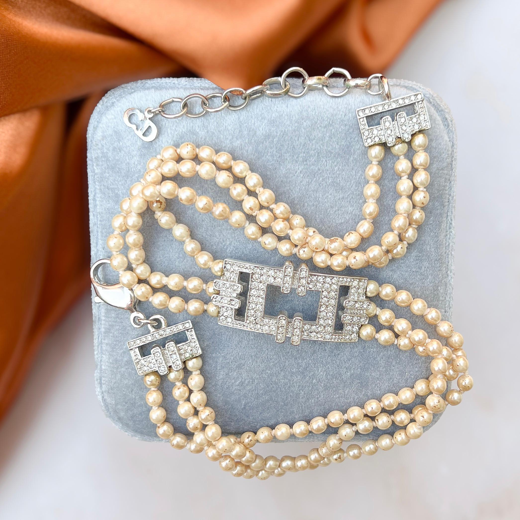 This elegant Christian Dior choker was made in the 1990s when John Galliano was designing for the French fashion house.

Condition Report:
Good - Some loss to the coating of a few of the faux pearls. This is only apparent upon very close inspection