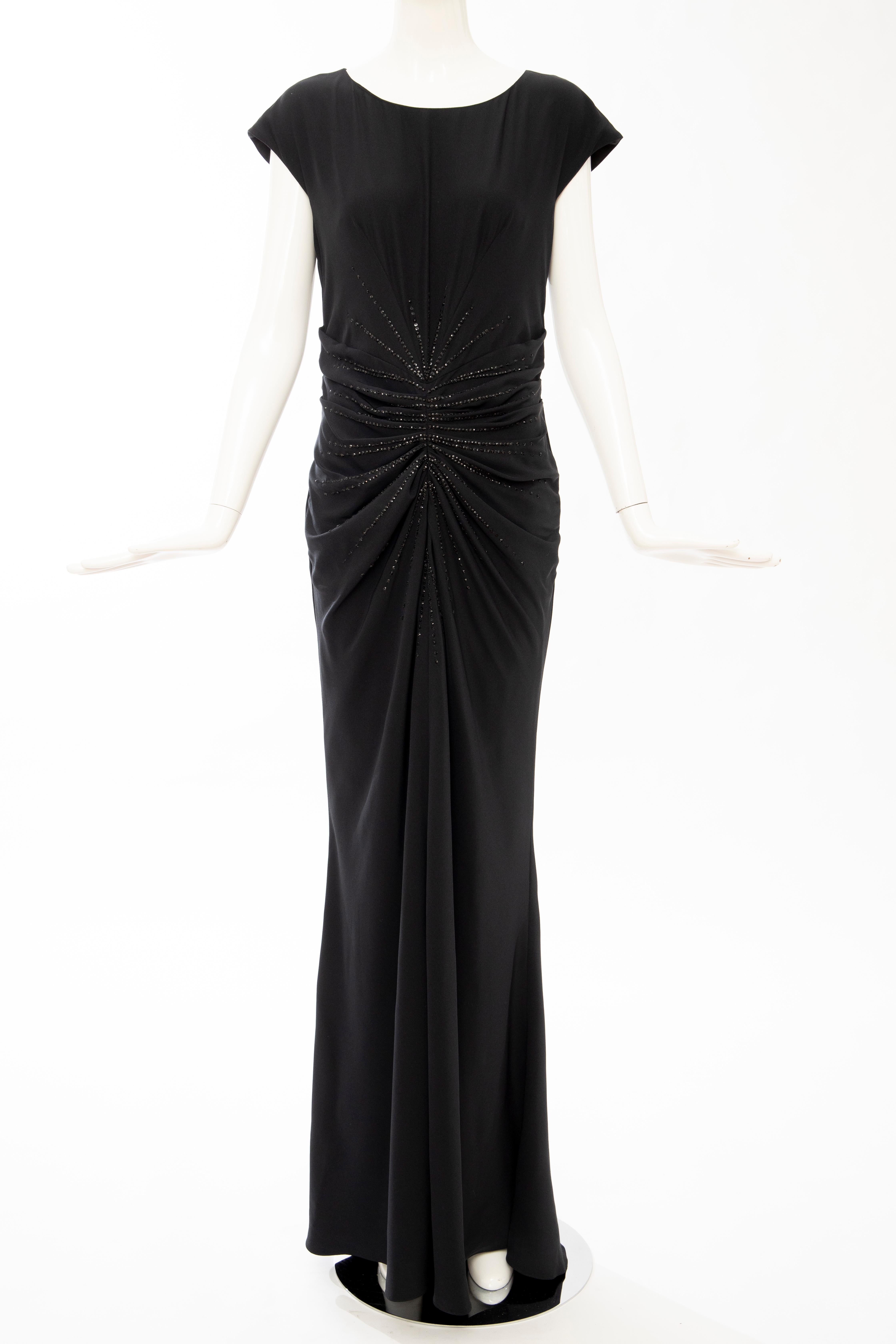 John Galliano for Christian Dior, Spring 2008 (Runway Look 42) black silk sleeveless evening dress with embroidered PVC glass embellishments throughout, crew neck and concealed zip closure at back.

FR. 42, IT. 46, GB. 14, US. 10

Bust: 34, Waist: