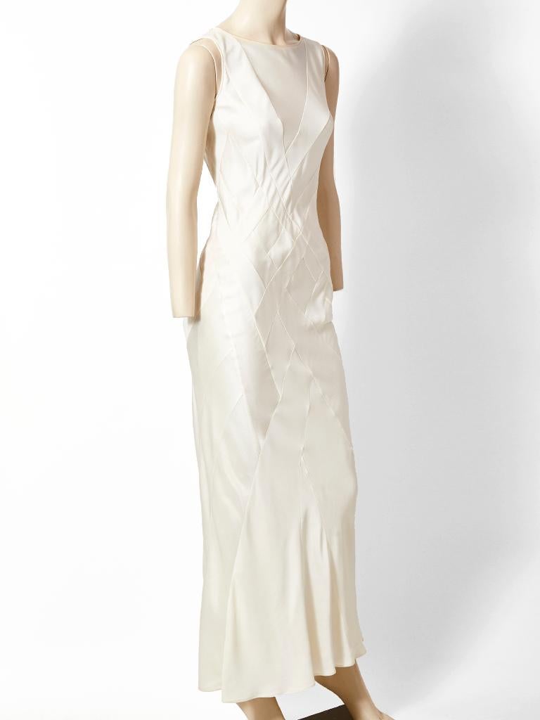 John Galliano, for Dior, ivory, satin back crepe,  bias cut sleeveless gown, having a jewel neckline, and patchwork detail.