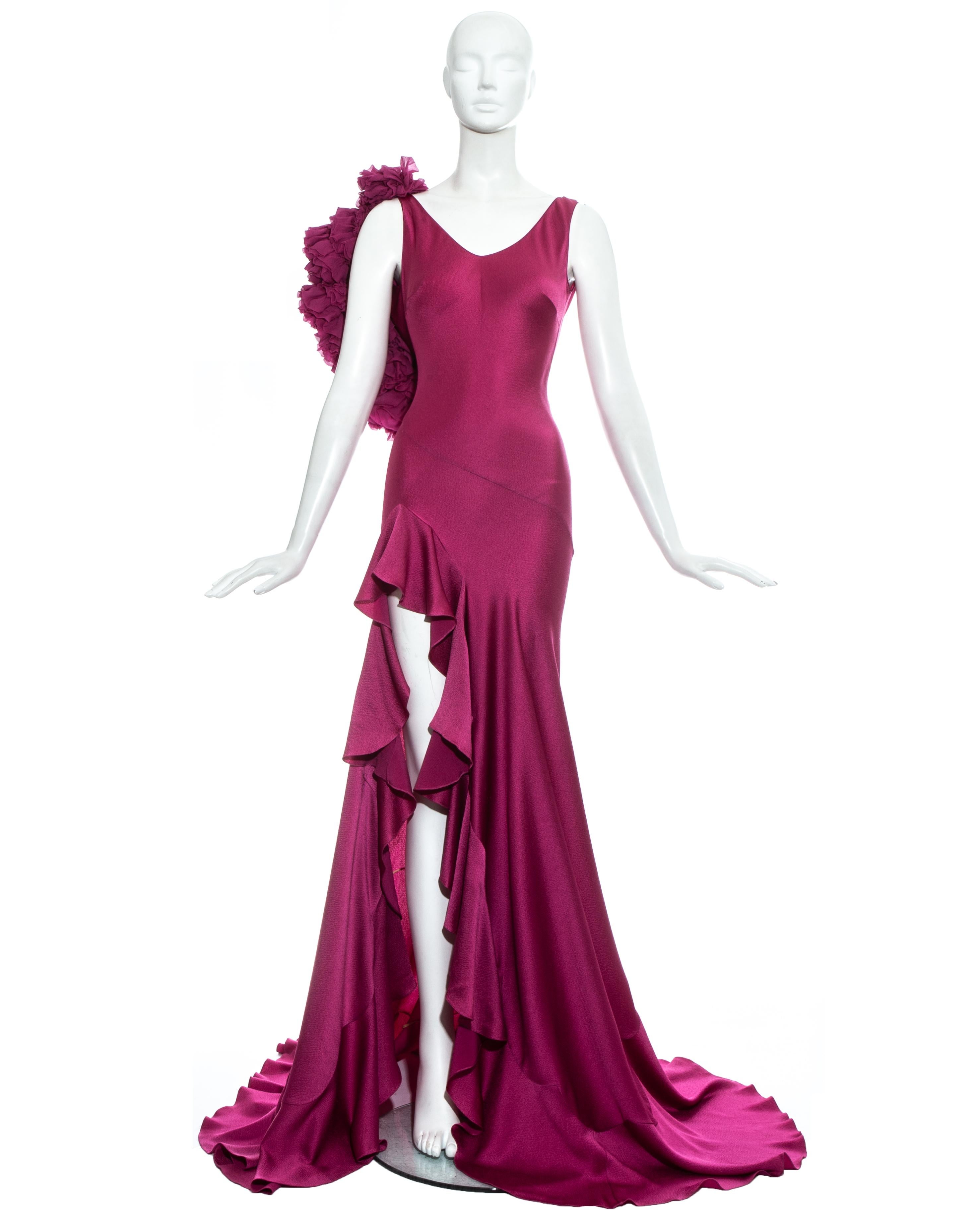 John Galliano; fuchsia silk bias cut flamenco inspired evening dress with high leg slit, flounce hem, low back and ruffled silk panel on one shoulder.

Fall-Winter 1995 


