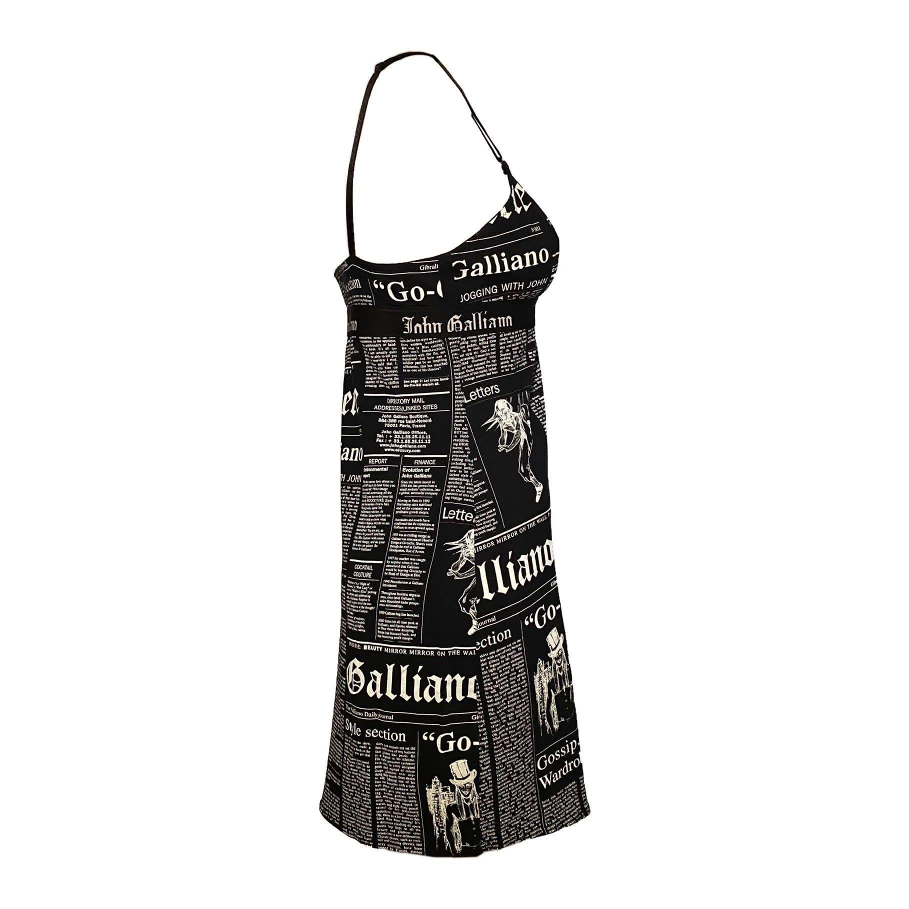 John Galliano early 2000s newspaper dress featuring the iconic “Gazette” print in black/white. Under-bust elastic logo band.

Size L, adjustable straps

Bust: 74 cm / 29.1 inch
Length (from pit): 61 cm / 24 inch