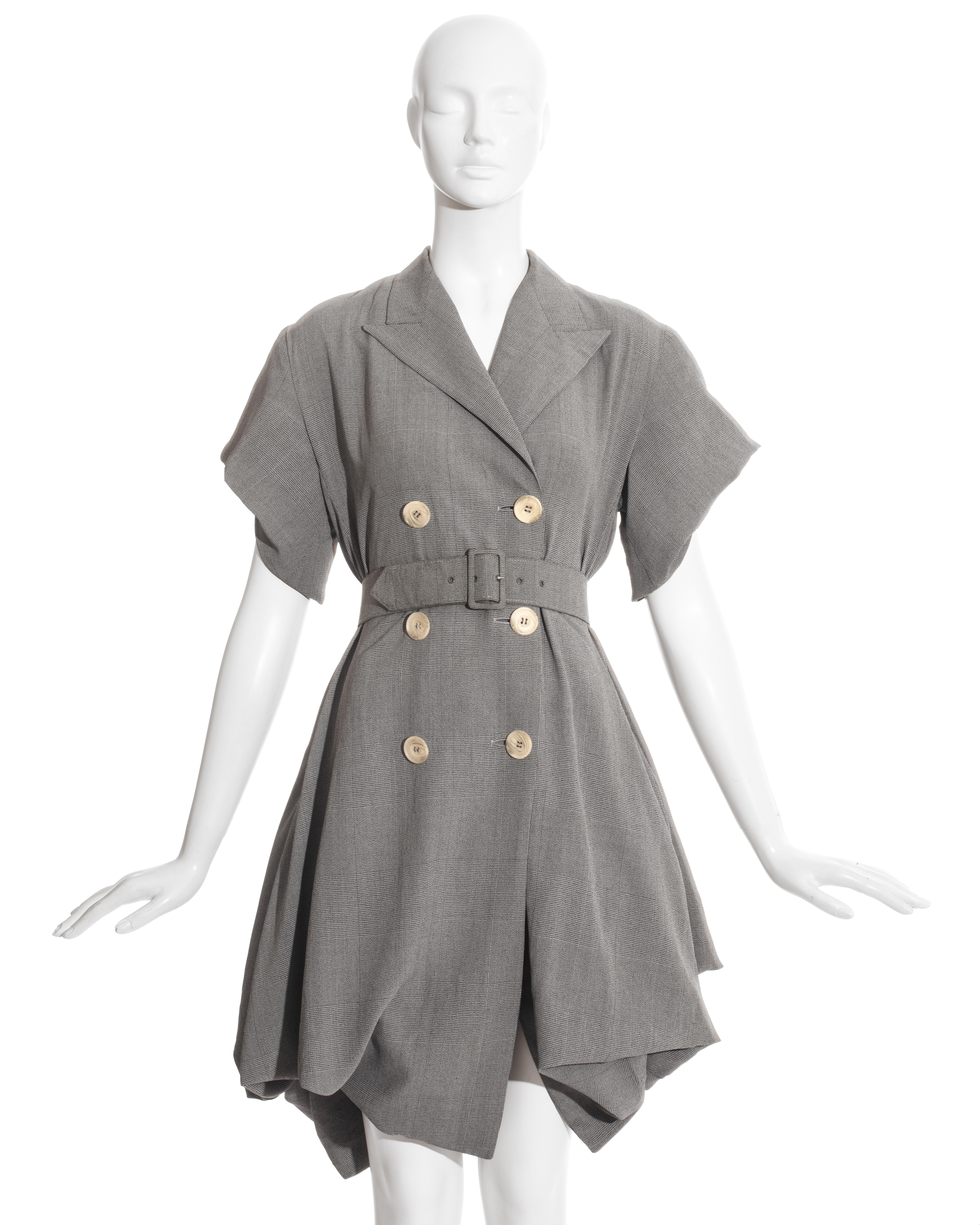 John Galliano London; grey rayon Prince of Wales check coat dress. Bustled skirt falling in polonaise drapes, gathering into a band at the hem - can be buttoned up to be made shorter.   

Blanche Dubois, Spring-Summer 1988