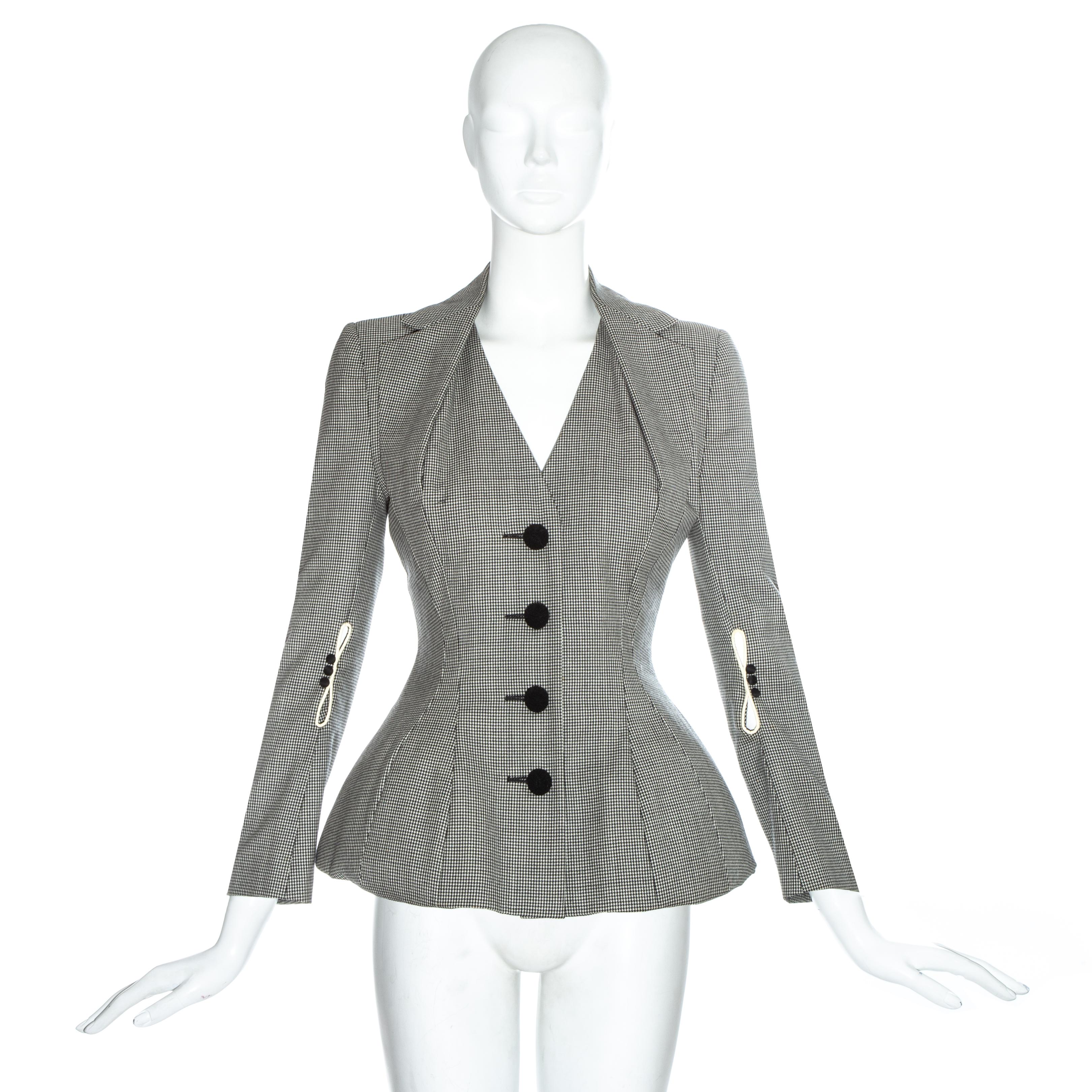 John Galliano hounds tooth check wool jacket with padded hips, halter-neck style lapel and cord covered buttons

Spring-Summer 1995