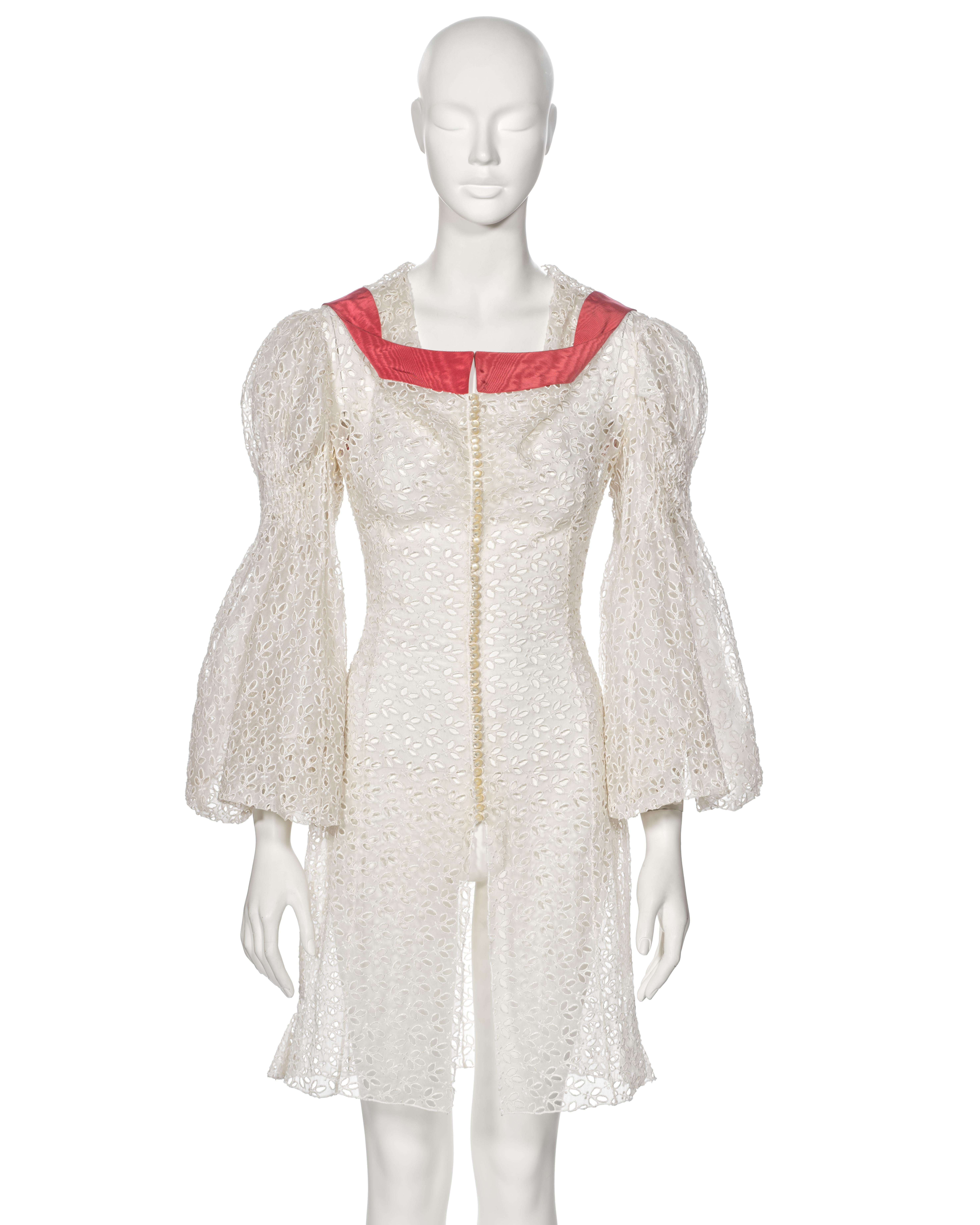 ▪ Archival John Galliano 'L'Ecole de Danse' Dress
▪ Spring-Summer 1996
▪ Sold by One of a Kind Archive
▪ Museum Grade
▪ Crafted from delicate ivory cotton organza with intricate cut-work detailing
▪ Features 50 faux-pearl buttons along the front