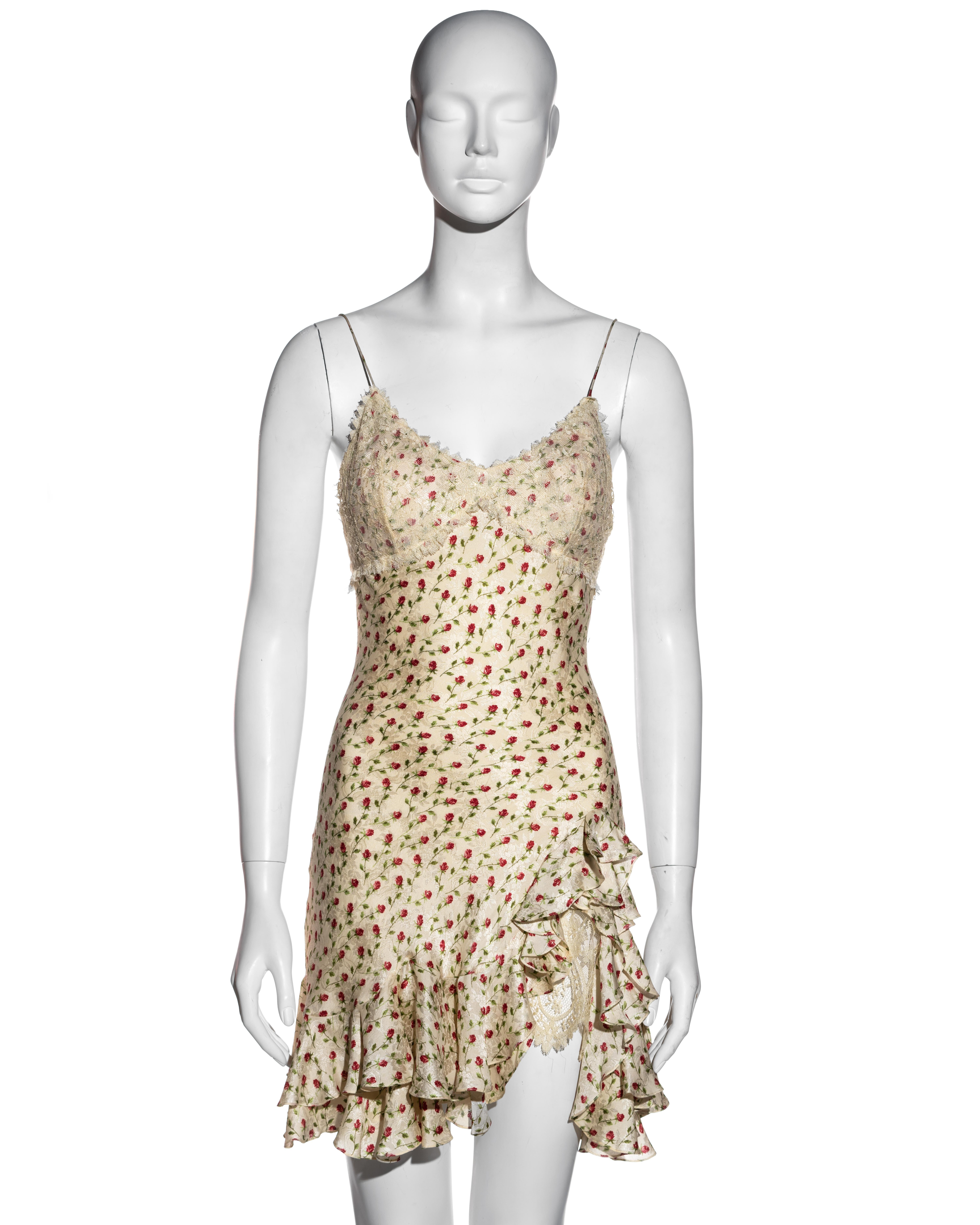 ▪ John Galliano ivory silk jacquard mini slip dress
▪  Red rose print 
▪ Padded breast cups with Chantilly lace overlay 
▪ Spaghetti straps 
▪ Bias-cut 
▪ Flounce mini skirt with two layers 
▪ High leg slit with Chantilly lace underlay 
▪ Silk