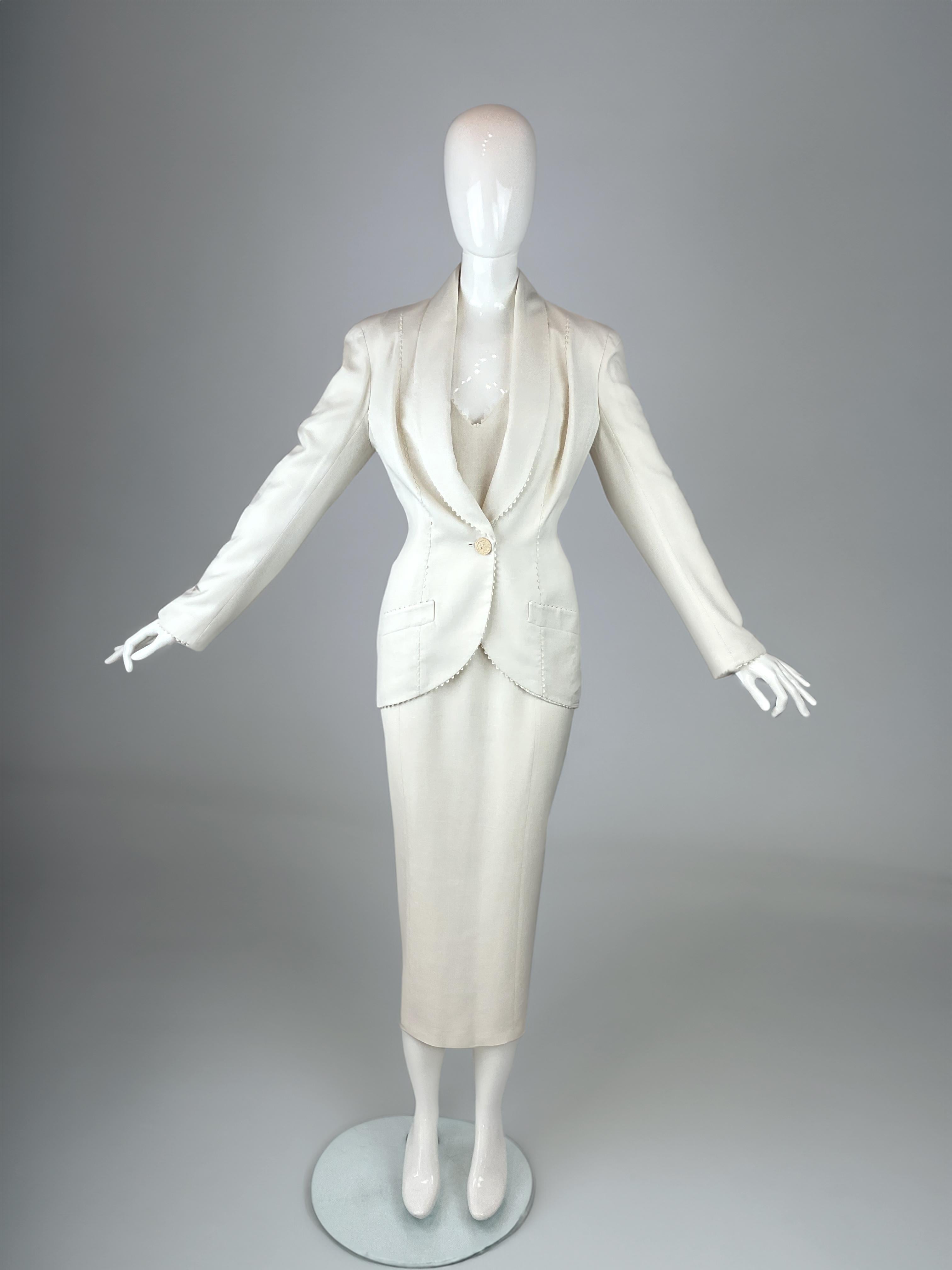 The perfect choice for a courthouse wedding, civil ceremony, or intimate summer celebration.

A rare two-piece ensemble designed by John Galliano for his Spring/Summer 2000 collection. Crafted in a luxe ivory linen & silk, the set includes a