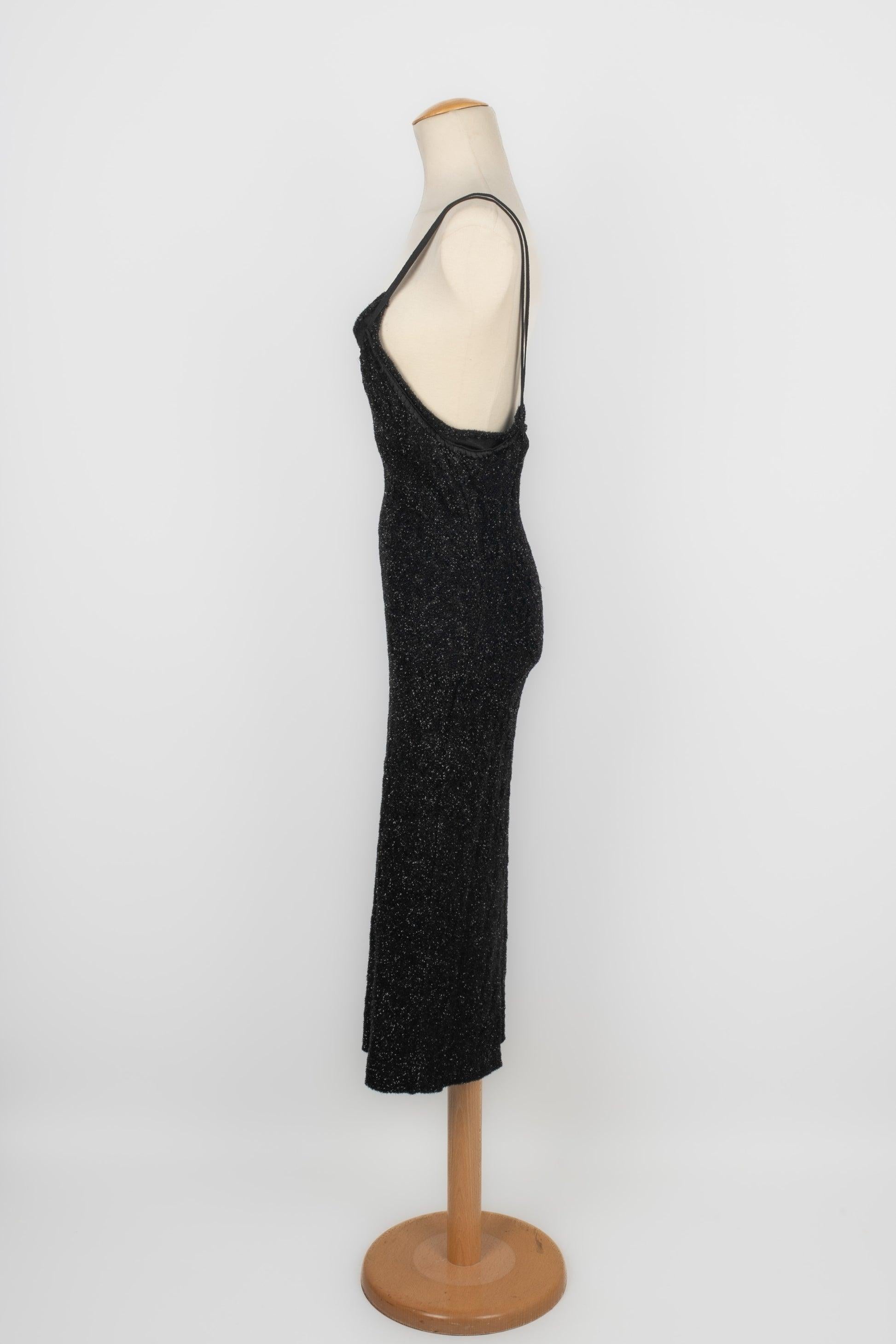 Galliano - Long mesh dress with silvery and black lurex threads. No size indicated, it fits a 34FR/36FR.

Additional information:
Condition: Very good condition
Dimensions: Chest: 36 cm - Waist: 30 cm - Hips: 40 cm - Length: 118 cm

Seller