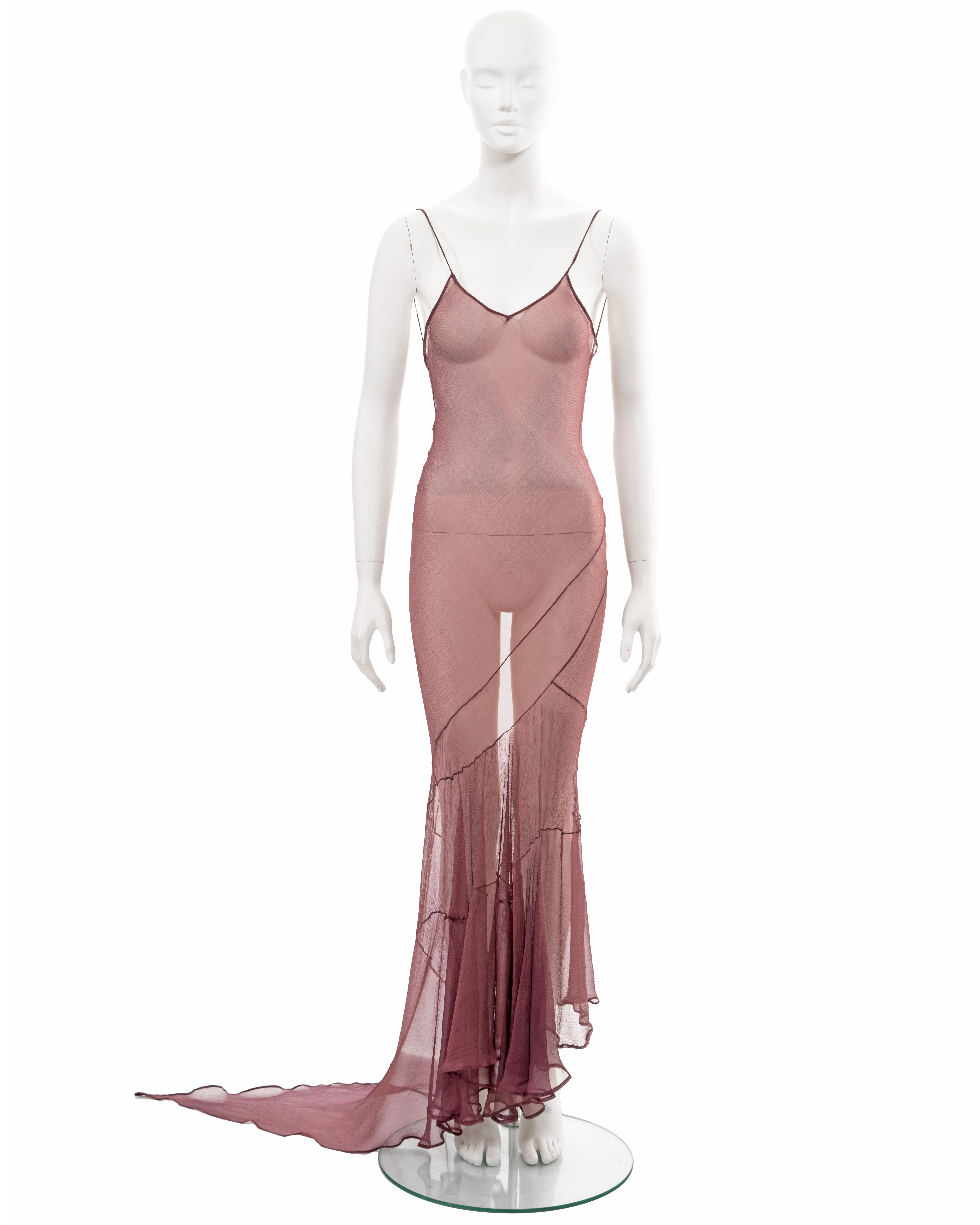 ▪ John Galliano evening slip dress
▪ Sold by One of a Kind Archive
▪ 'Filibusters', Spring-Summer 1993
▪ Museum Grade
▪ Constructed from maroon bias-cut silk chiffon 
▪ Descending hemline with pointed train 
▪ Spaghetti straps 
▪ Two string ties