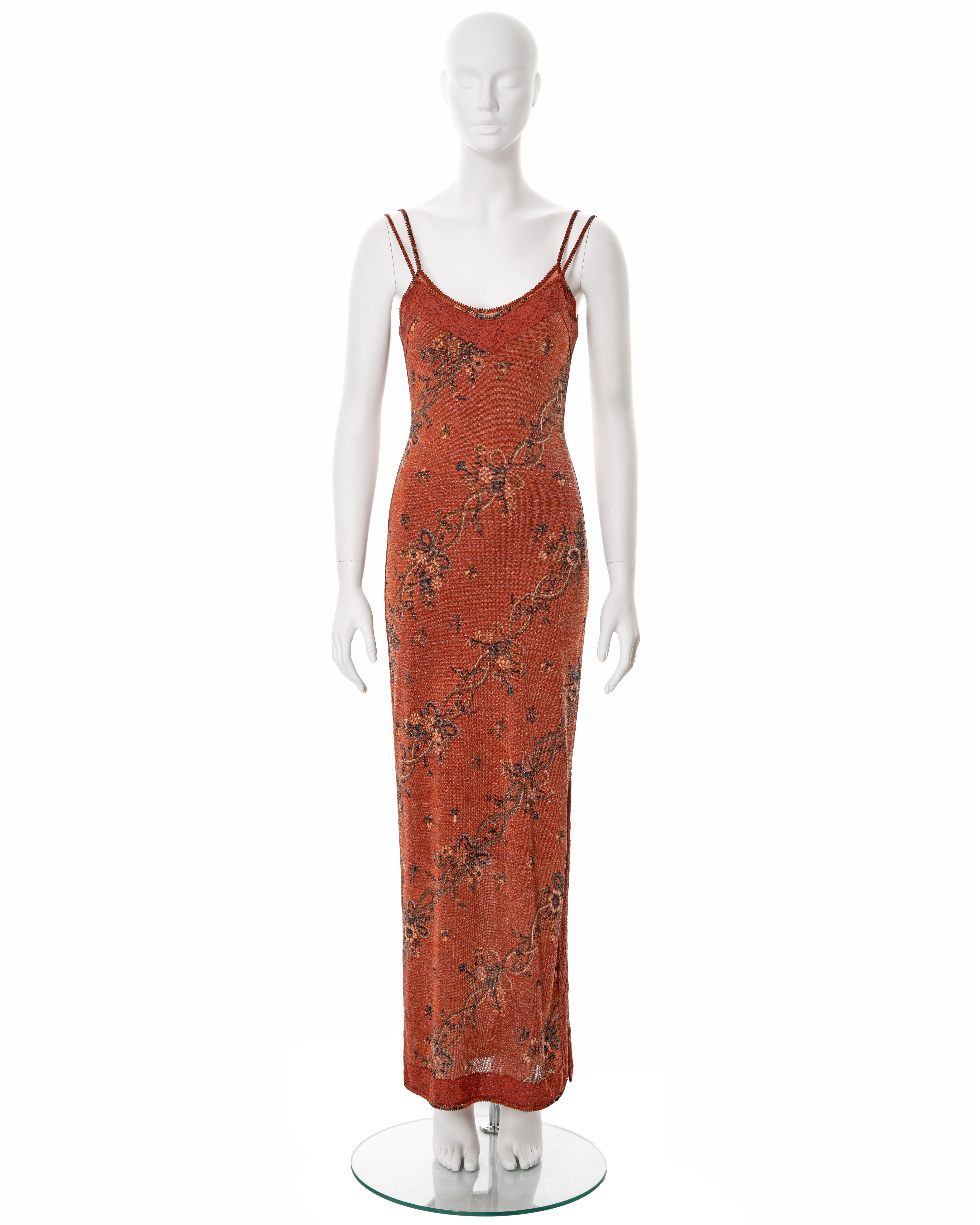 ▪ John Galliano maxi dress
▪ Sold by One of a Kind Archive
▪ Fall-Winter 2000
▪ Constructed from metallic copper viscose knit with floral motifs 
▪ Chantilly lace trim
▪ Double-layered
▪ Four spaghetti straps 
▪ Floor-length skirt with leg slit at