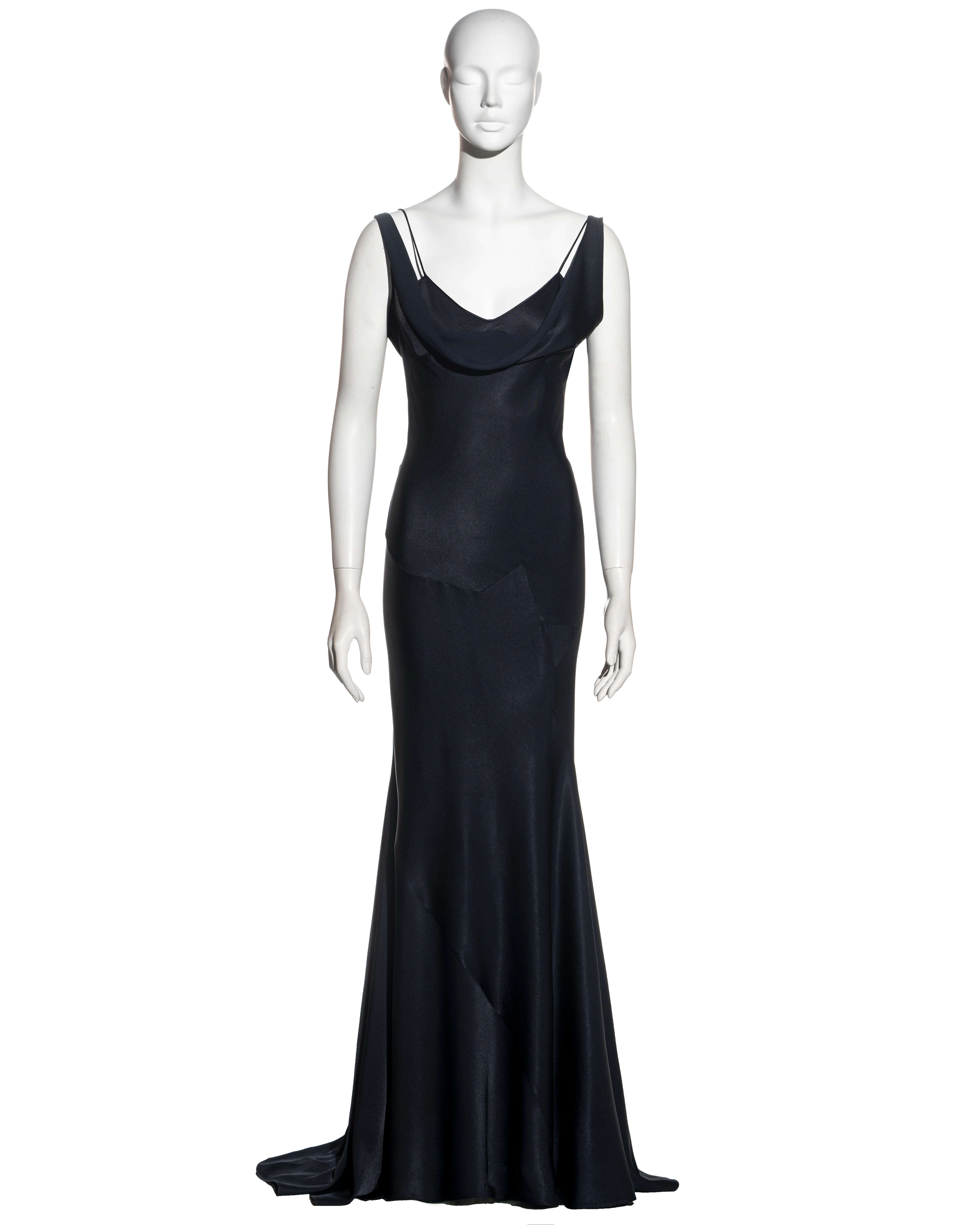 ▪ John Galliano midnight blue bias cut evening dress 
▪  Demi-star-shaped bias insert
▪ Draped cowls to front and back of bodice
▪ Spaghetti and off-shoulder straps 
▪ Floor length skirt with train
▪ FR 38 / US 6
▪ Fall-Winter 1995
▪ 68% Acetate,