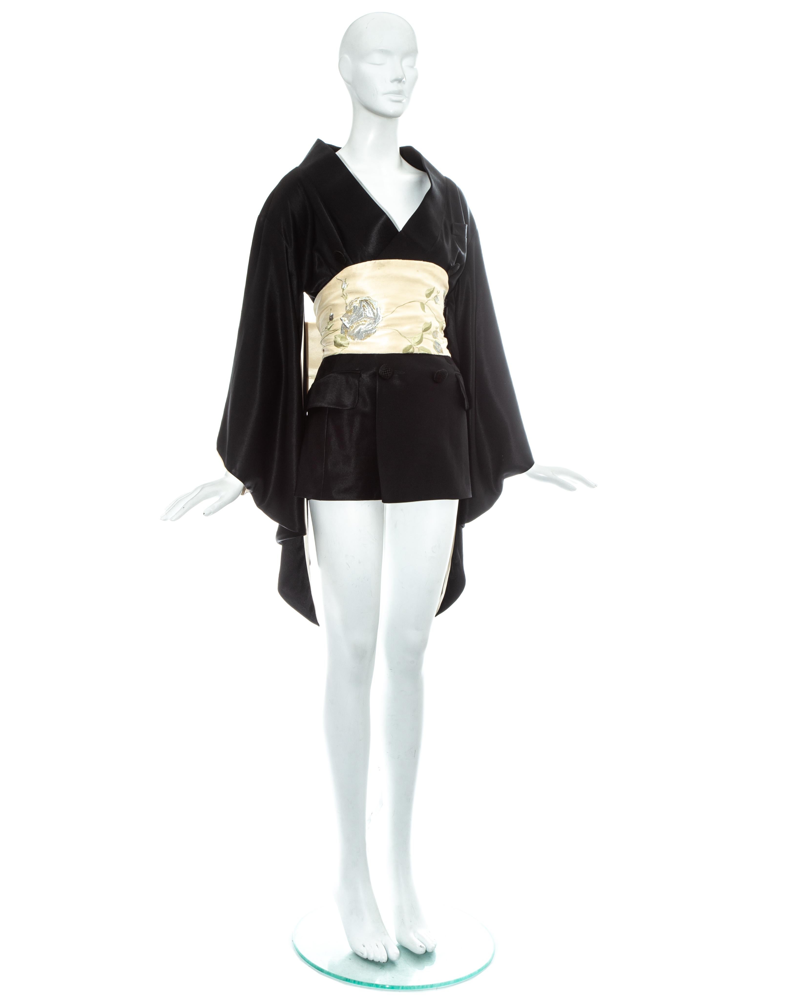 John Galliano; Black satin 'Minimono' / kimono mini dress with embroidered silk obi belt. From the 'Black' collection, one of Galliano's most revered and collectible collections. 

Fall-Winter 1994