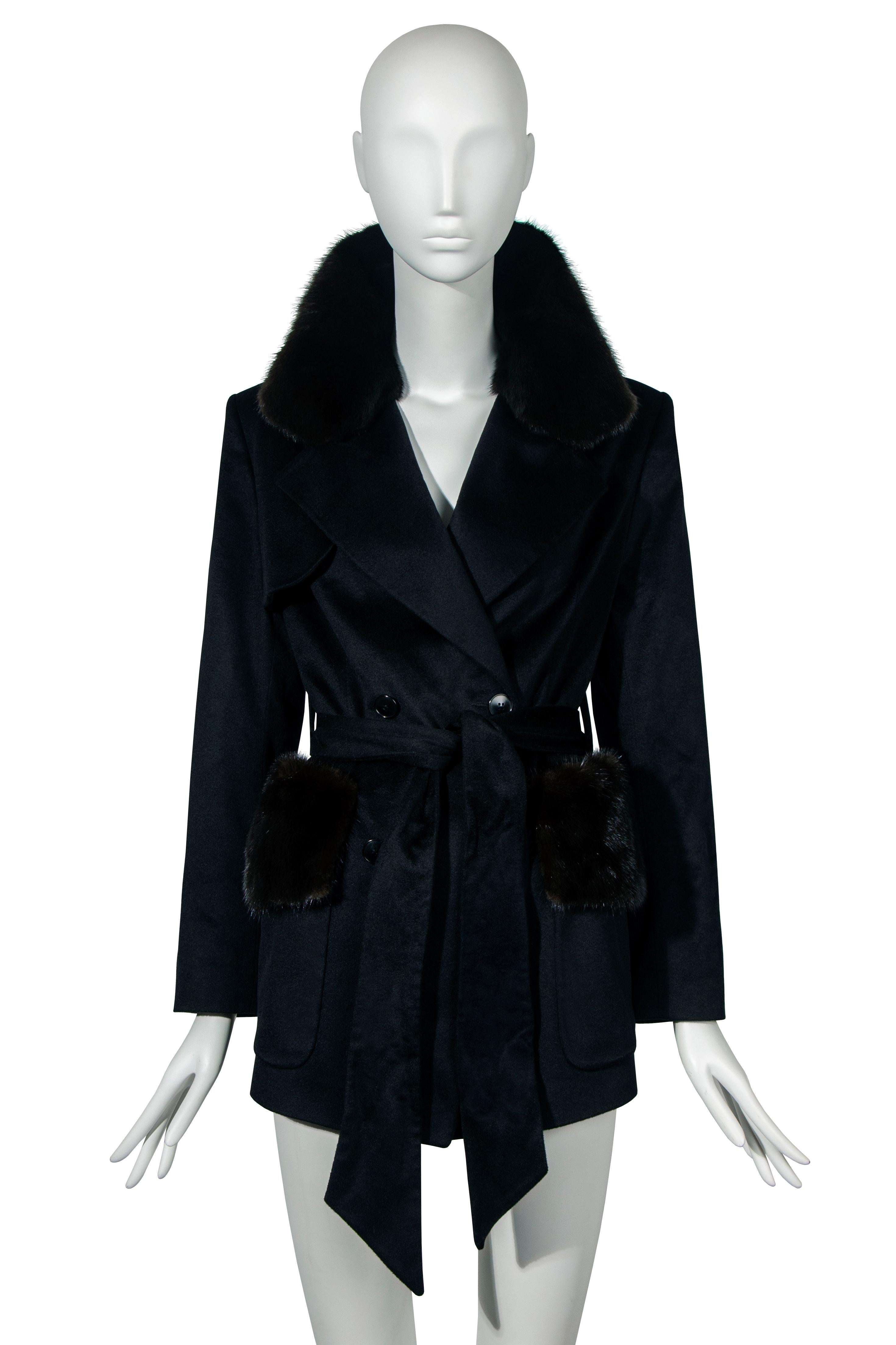 A John Galliano mink and cashmere cropped trench coat, fall-winter 1997 ‘Suzy Sphinx’. This elegant hip length coat is crafted from black cashmere that is indescribably soft to the touch. The stand out feature of this coat is the fur collar and