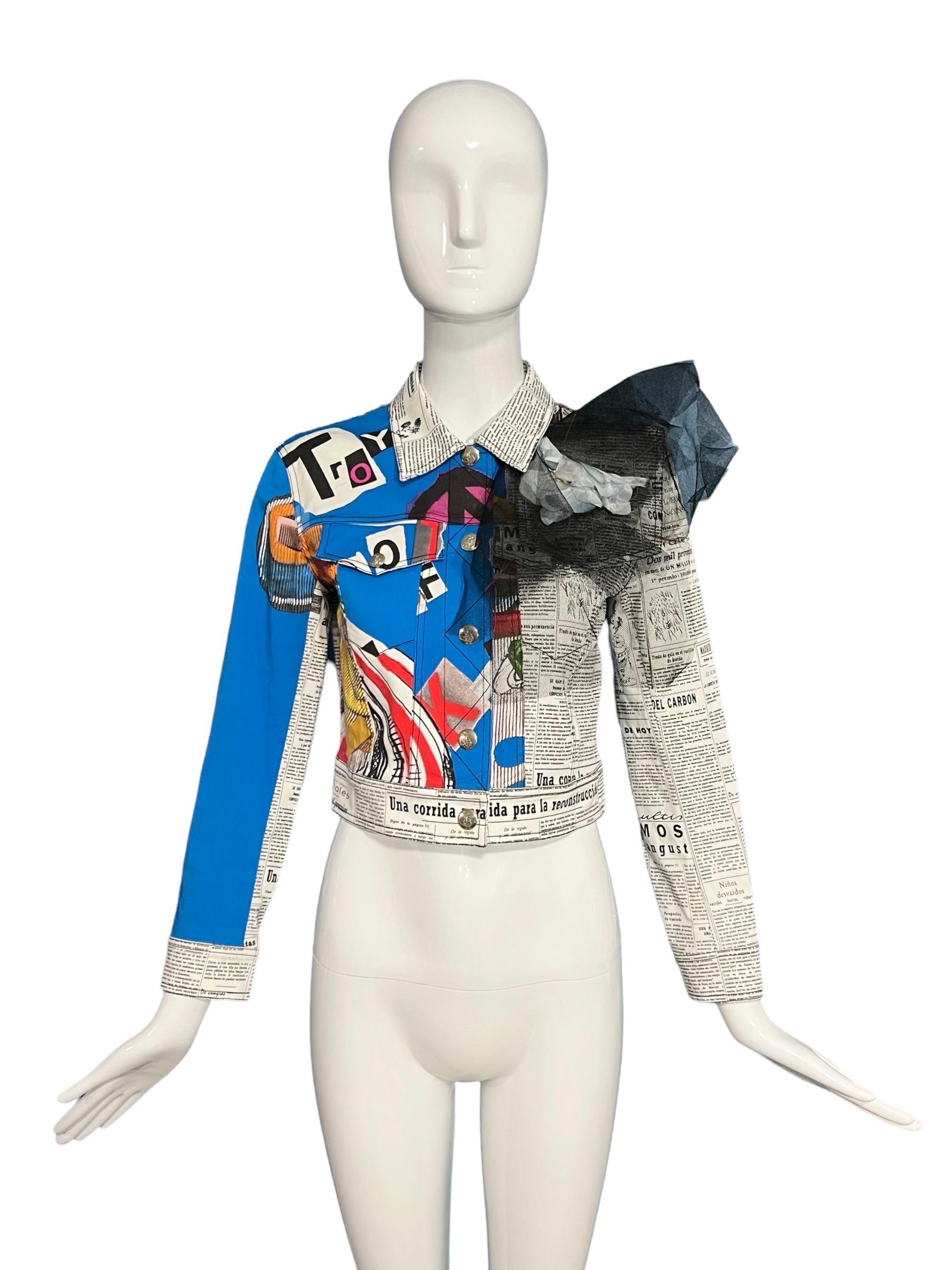 Rare newspaper and graffiti printed jacket from the collectible Spring 2001 collection and as seen on the runway.
Two front patch pockets.
Features abstract drawings and newspaper prints throughout.
Decorative abstract flower with tulle on the front
