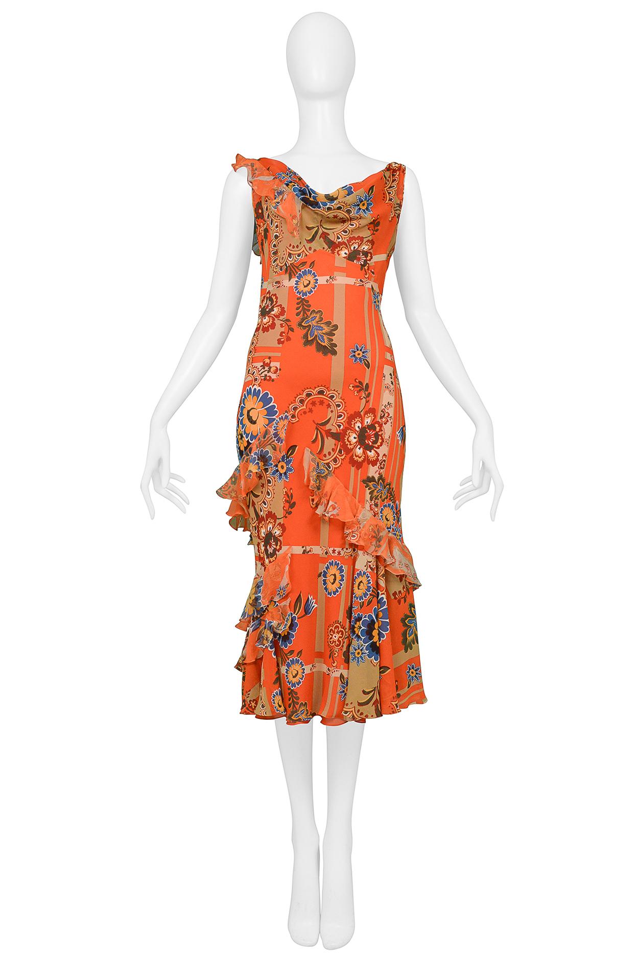 Resurrection is excited to offer a stunning vintage John Galliano orange-red  slip dress featuring a decorative floral print, chiffon ruffles, asymmetrical neckline, open back with cowl draping and over the knee length. From the Fall 2004