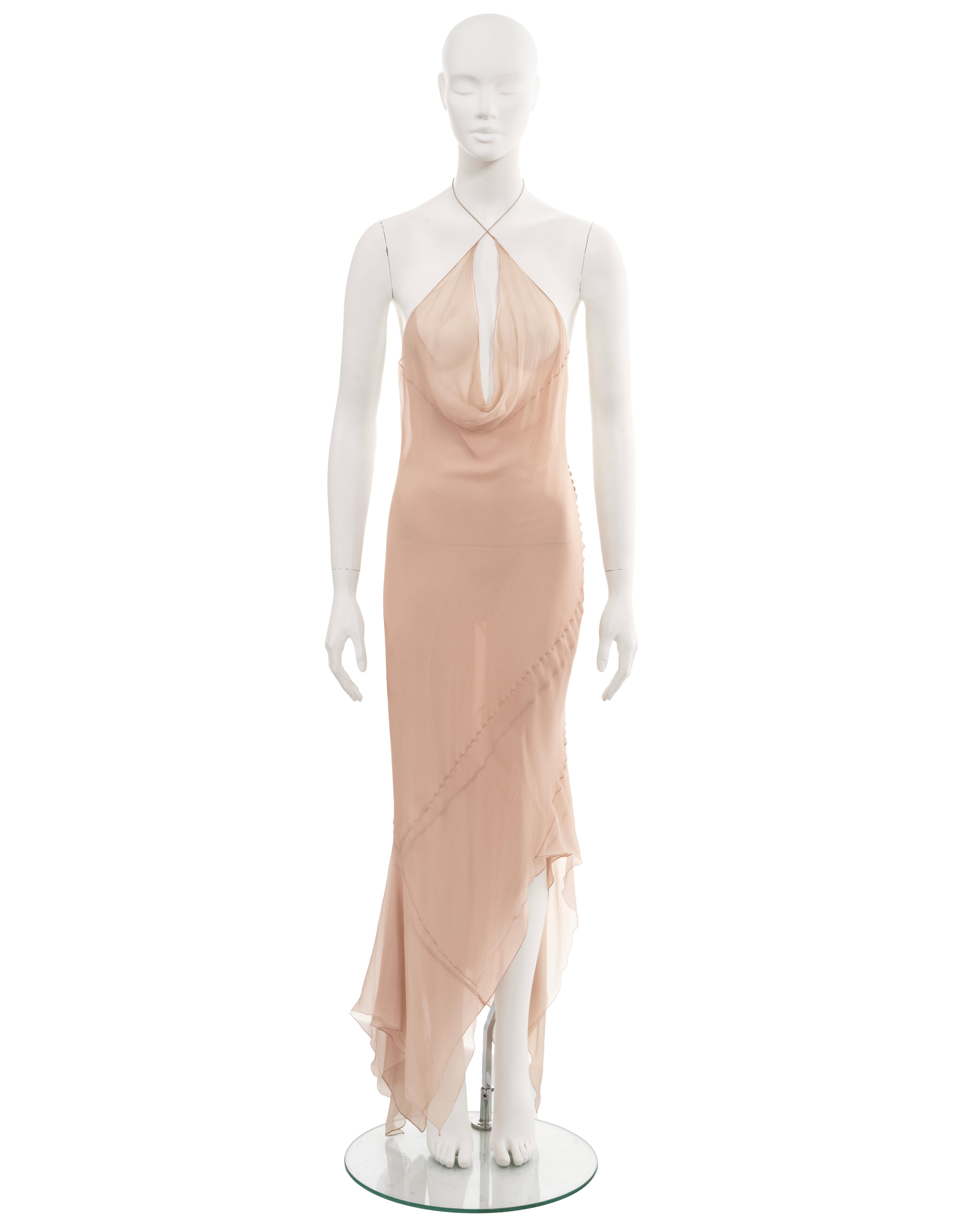 ▪ John Galliano evening dress
▪ Fall-Winter 1997
▪ Sold by One of a Kind Archive
▪ Double-layered pale pink bias-cut silk chiffon 
▪ 2 string halterneck ties 
▪ Plunging cowl neck
▪ Low back
▪ Asymmetric hemline 
▪ Size approx. Medium 

All