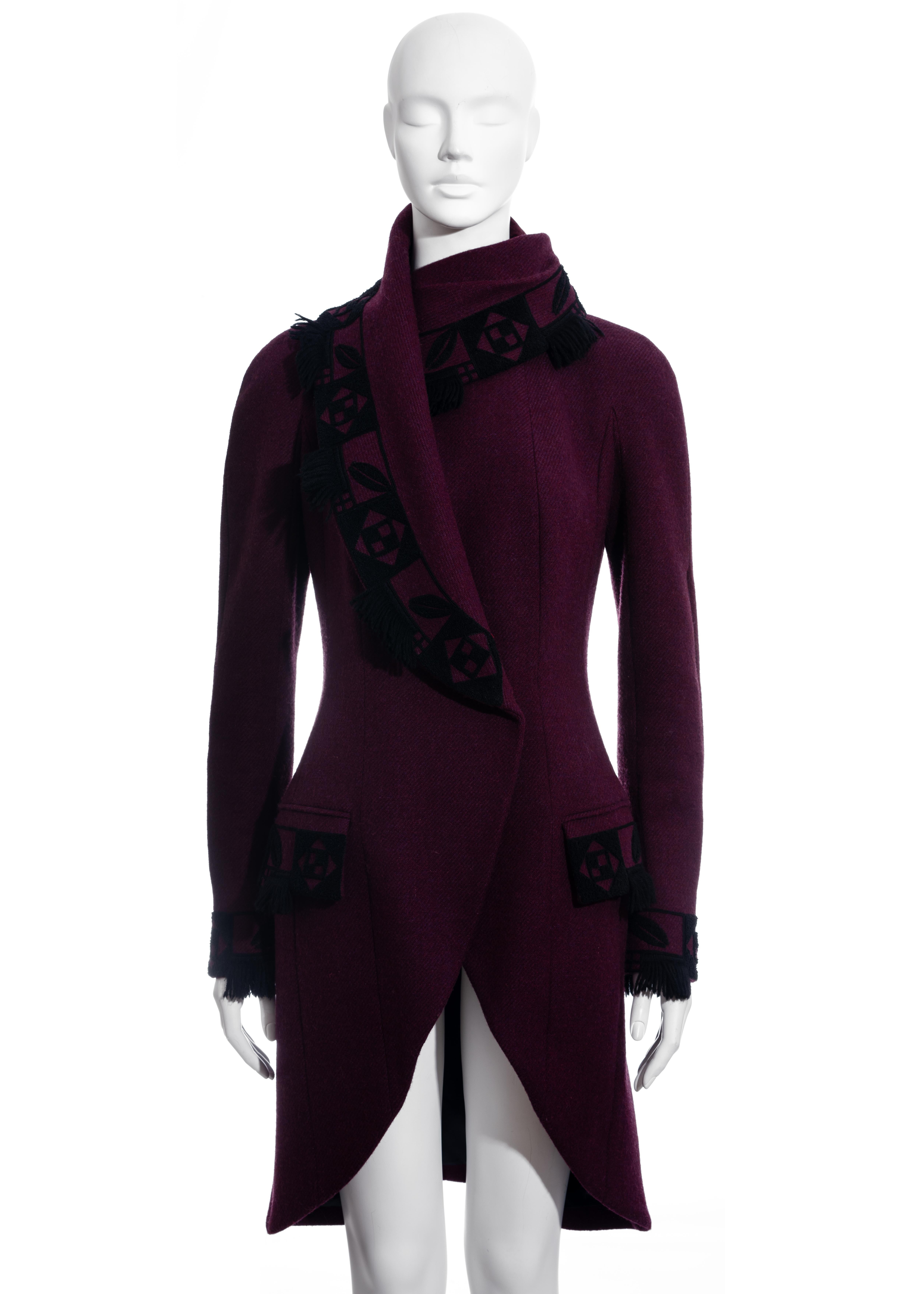 ▪ John Galliano plum wool coat
▪ 100% Wool, Lining: 100% Silk
▪ Black pattern trim with tassels  
▪ Fabric covered buttons on cuffs
▪ Shawl lapel draped around the neck fastening with hidden buttons 
▪ IT 44 - FR 40 - UK 12 - US 8
▪ Fall-Winter 1998