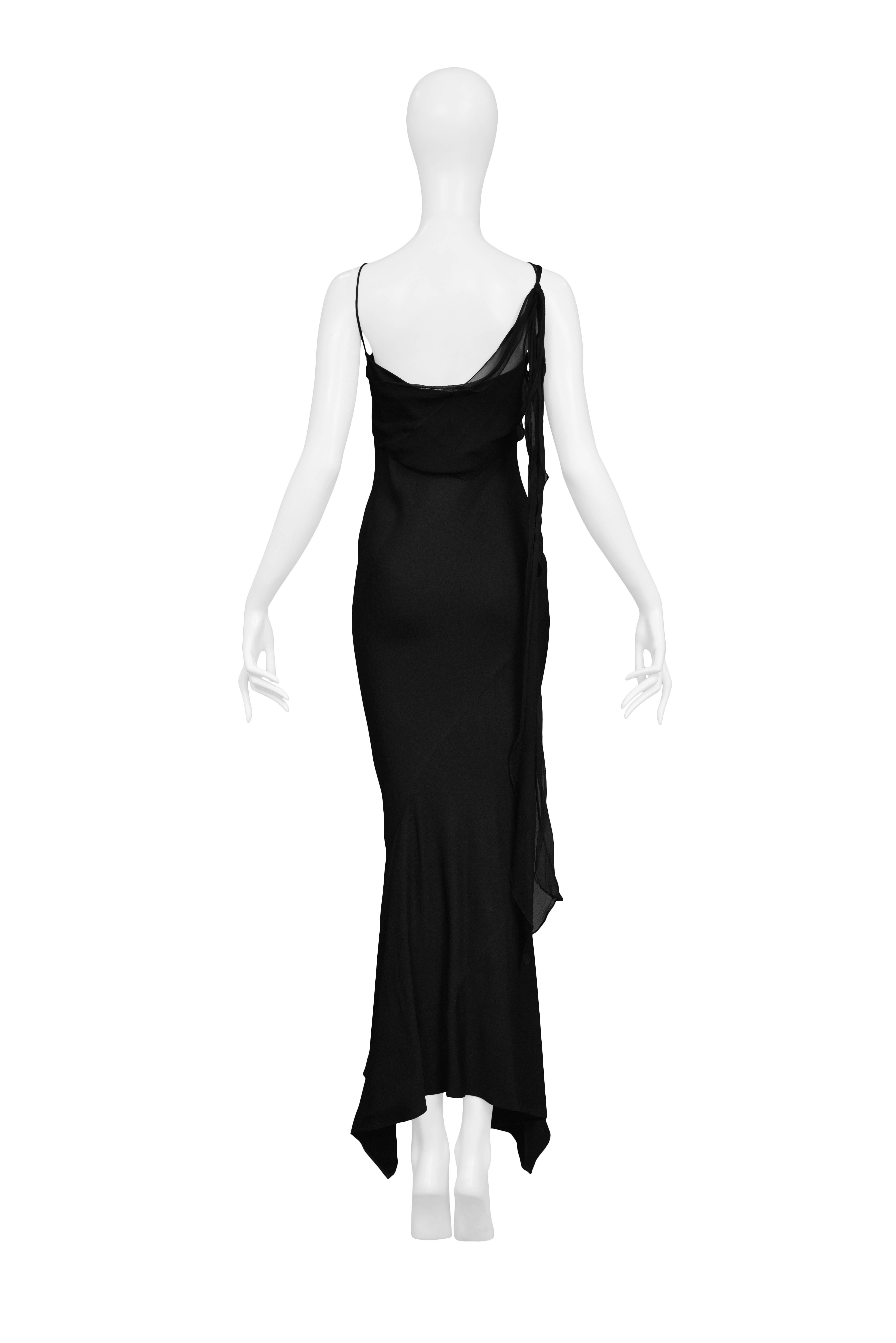 JOHN GALLIANO

PRINCESS LUCRETIA BLACK SLIP 1994
Condition : Excellent Vintage Condition
John Galliano black crepe bias cut slip dress featuring drape neckline, spaghetti straps and single chiffon tie at shoulder. From the Spring / Summer 1994