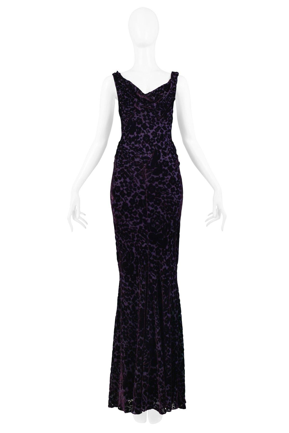 Resurrection is pleased to offer this vintage John Galliano deep purple floral Devore velvet bias cut gown featuring a draped V- neckline, slightly flared skirt, and self-faced buttons at side closure.

John Galliano 
Size 44
Measurements: (Measured