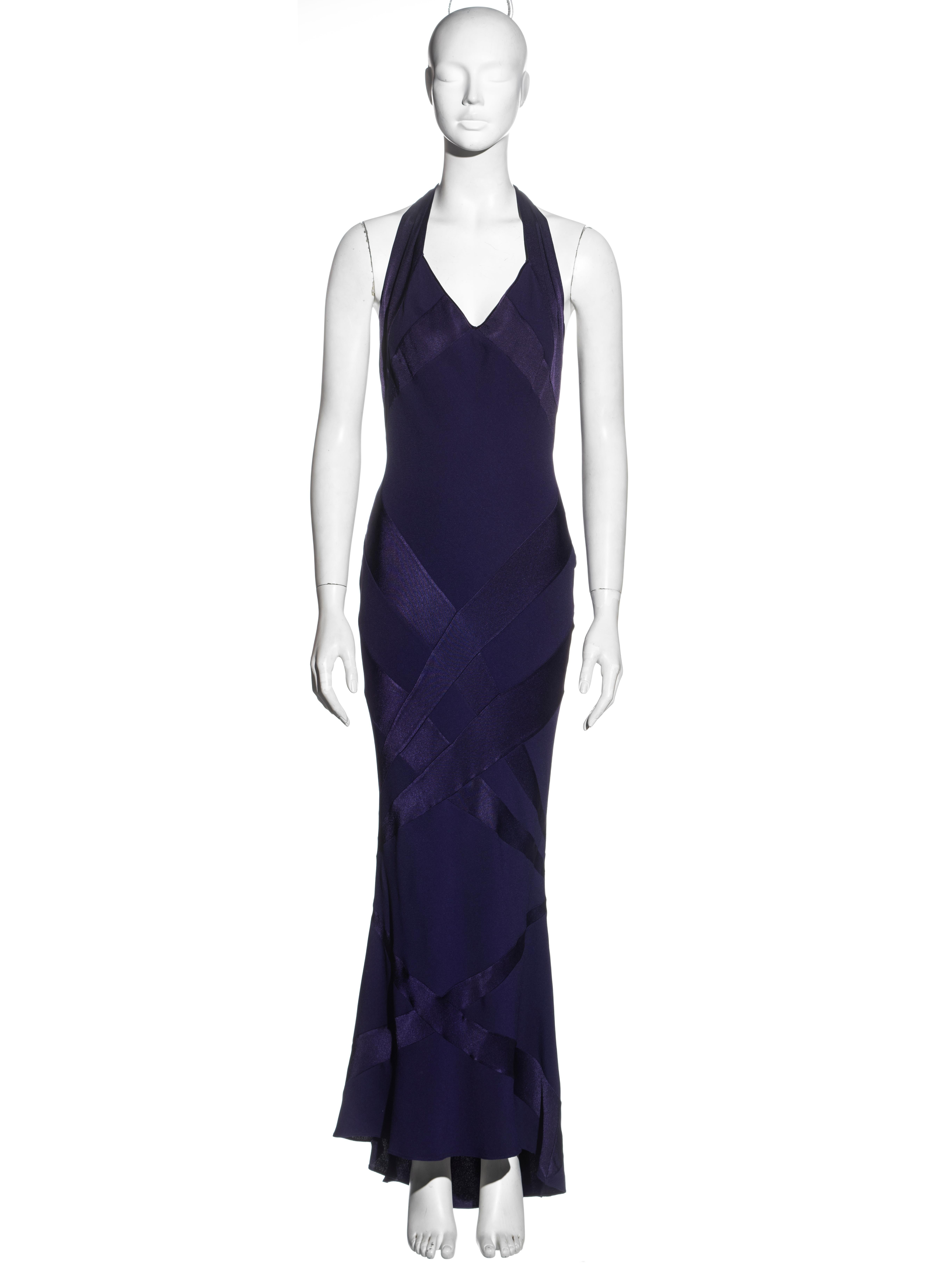 ▪ John Galliano evening dress 
▪ Purple satin-backed crepe 
▪ Multiple bias-cut panels 
▪ Long halter-neck ties with silk thread fringes 
▪ FR 40 - UK 12 - US 6
▪ Fall-Winter 2002
▪ 68% Acetate, 32% Rayon
▪ Made in France