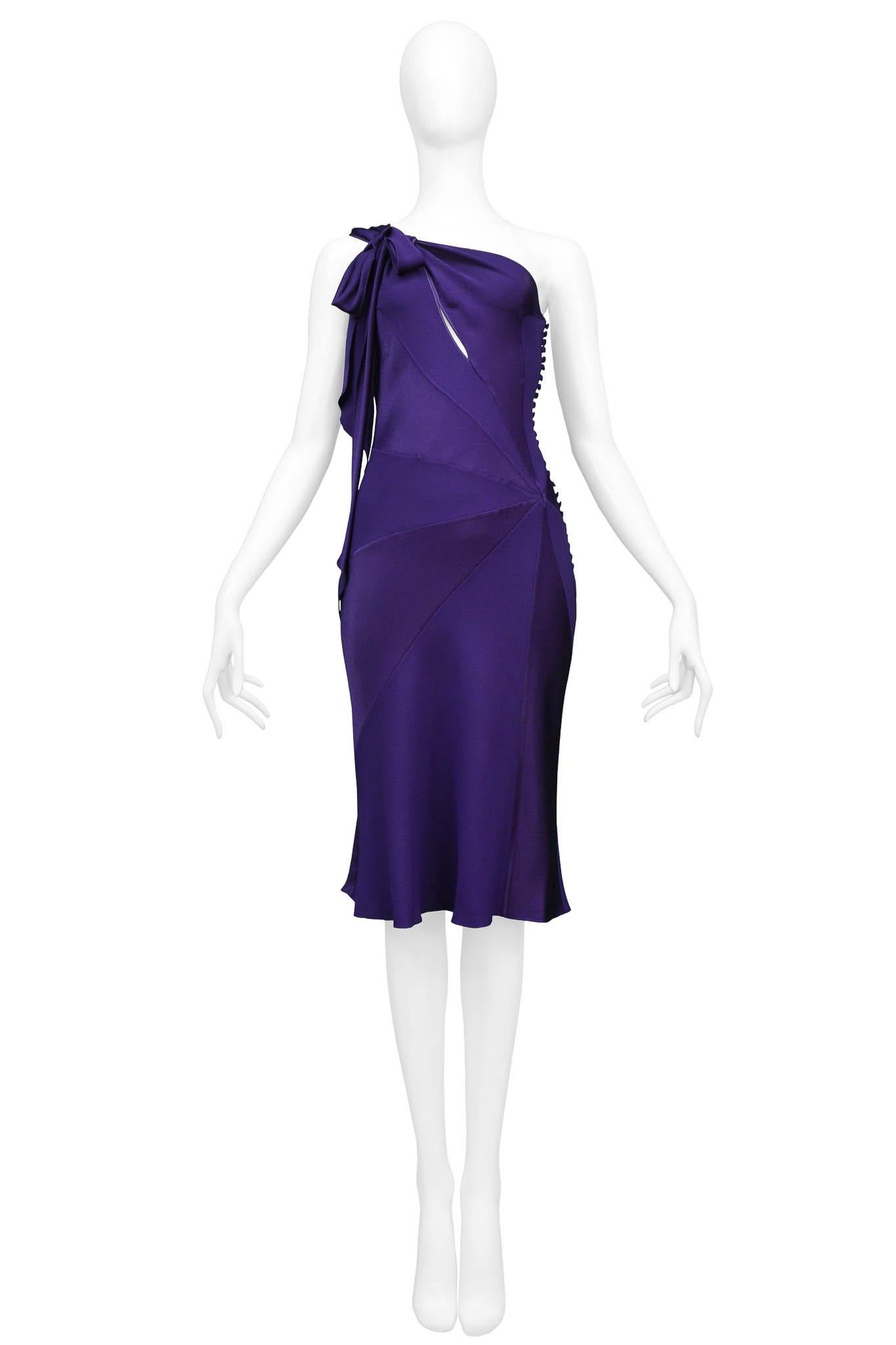 Resurrection is excited to offer a vintage John Galliano purple bias dress featuring, one shoulder strap with a bow at the front, an open slit along the bust area, and signature multi-button closure along the side seam.

John Galliano
Size F