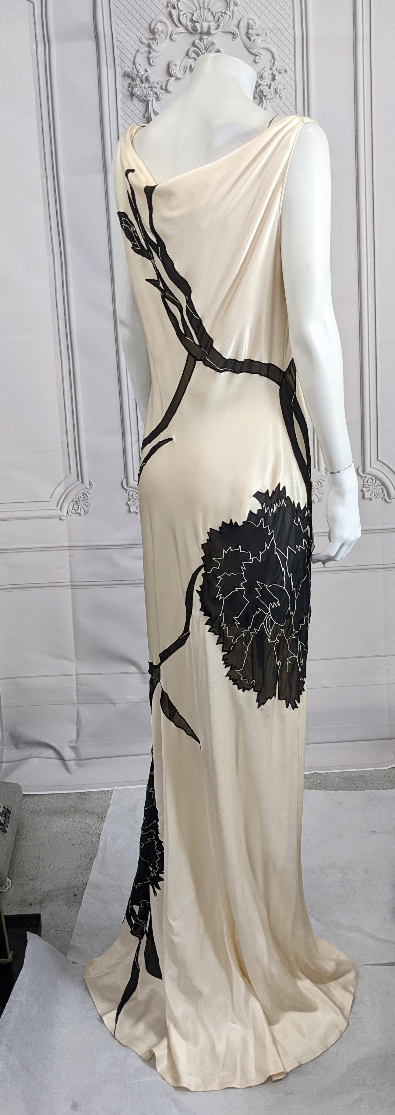 A rare John Galliano bias cut Carnation dress from the Dolores collection, Autumn-Winter 1995-96. Of  Bianchini Férier ivory and black satin backed rayon acetate crêpe inset with intarsia'd black chiffon and satin embroidered in white silk running