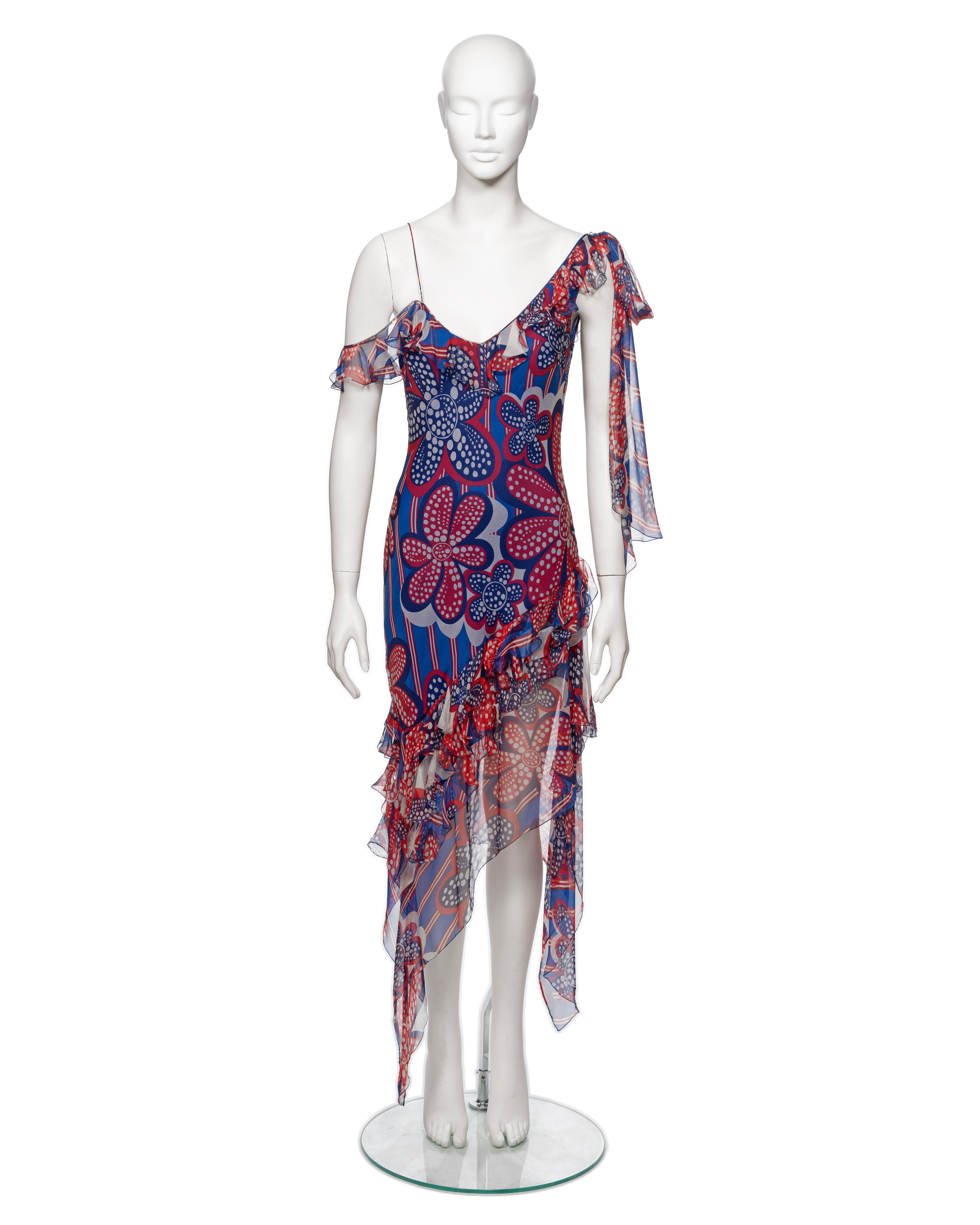▪ Brand: John Galliano
▪ Creative Director: John Galliano
▪ Collection: Spring-Summer 2002
▪ Sold by: One of a Kind Archive
▪ Fabric: Silk
▪ Details: Red, blue and white 70's inspired floral print, ruffled trim, asymmetric hemline, two long ties at