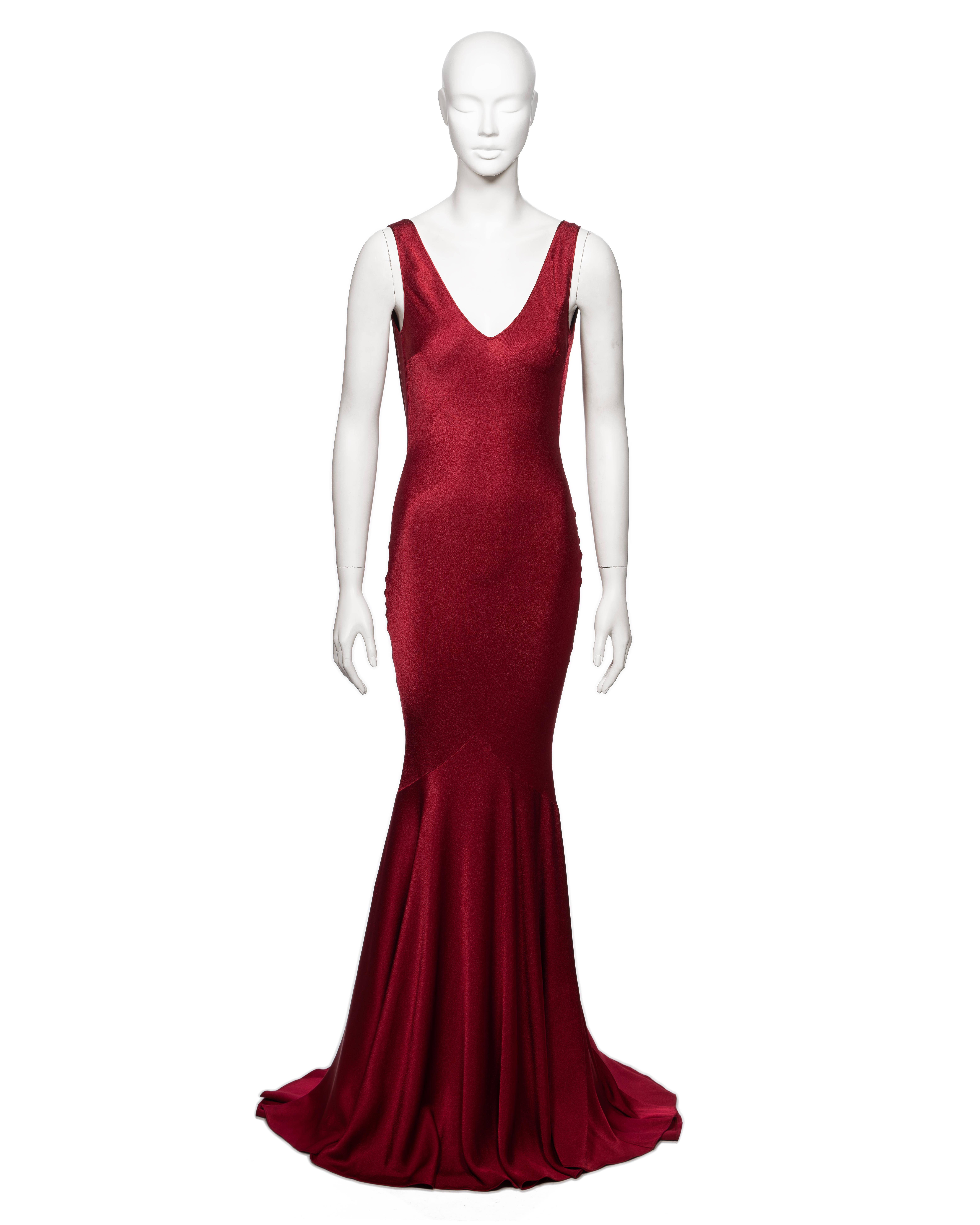 ▪ Brand: John Galliano
▪ Creative Director: John Galliano
▪ Collection: Fall-Winter 2001
▪ Sold by: One of a Kind Archive
▪ Fabric: Red crêpe-backed satin, 68% Acetate, 32% Viscose
▪ Details: V-neck, low back with cowl, floor-length flared skirt