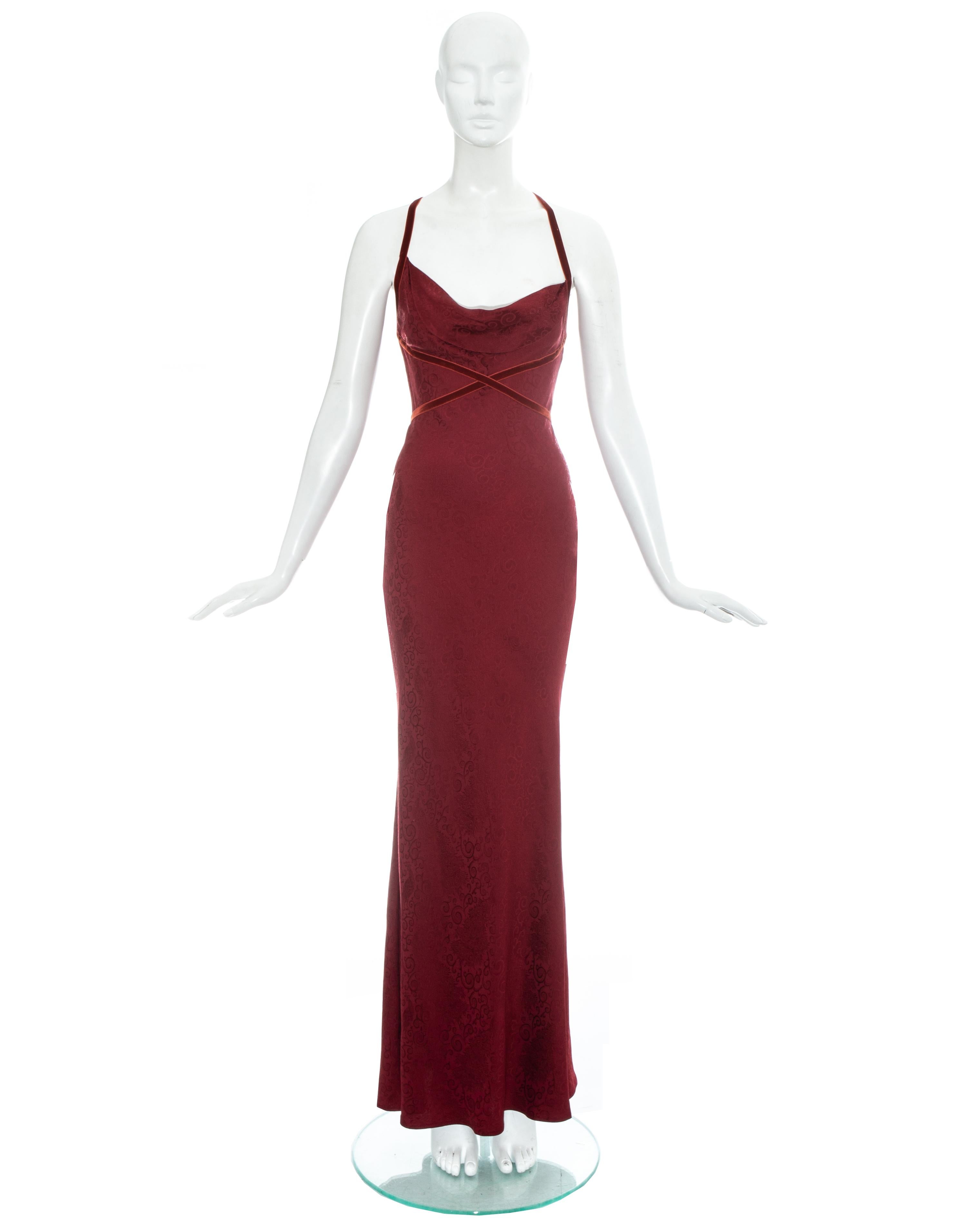 John Galliano red silk evening maxi dress with draped neckline and velvet criss-cross fastening on the waist. Sold with a matching blazer jacket with velvet waterfall collar.

Fall-Winter 1999