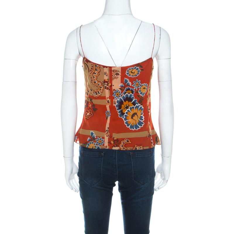 Have everyone marvel at this gorgeous top from John Galliano. Spruce up your wardrobe when you add this orange top to it. Made from the best quality silk, this top will remain a classic in your collection.

Includes:  Price Tag