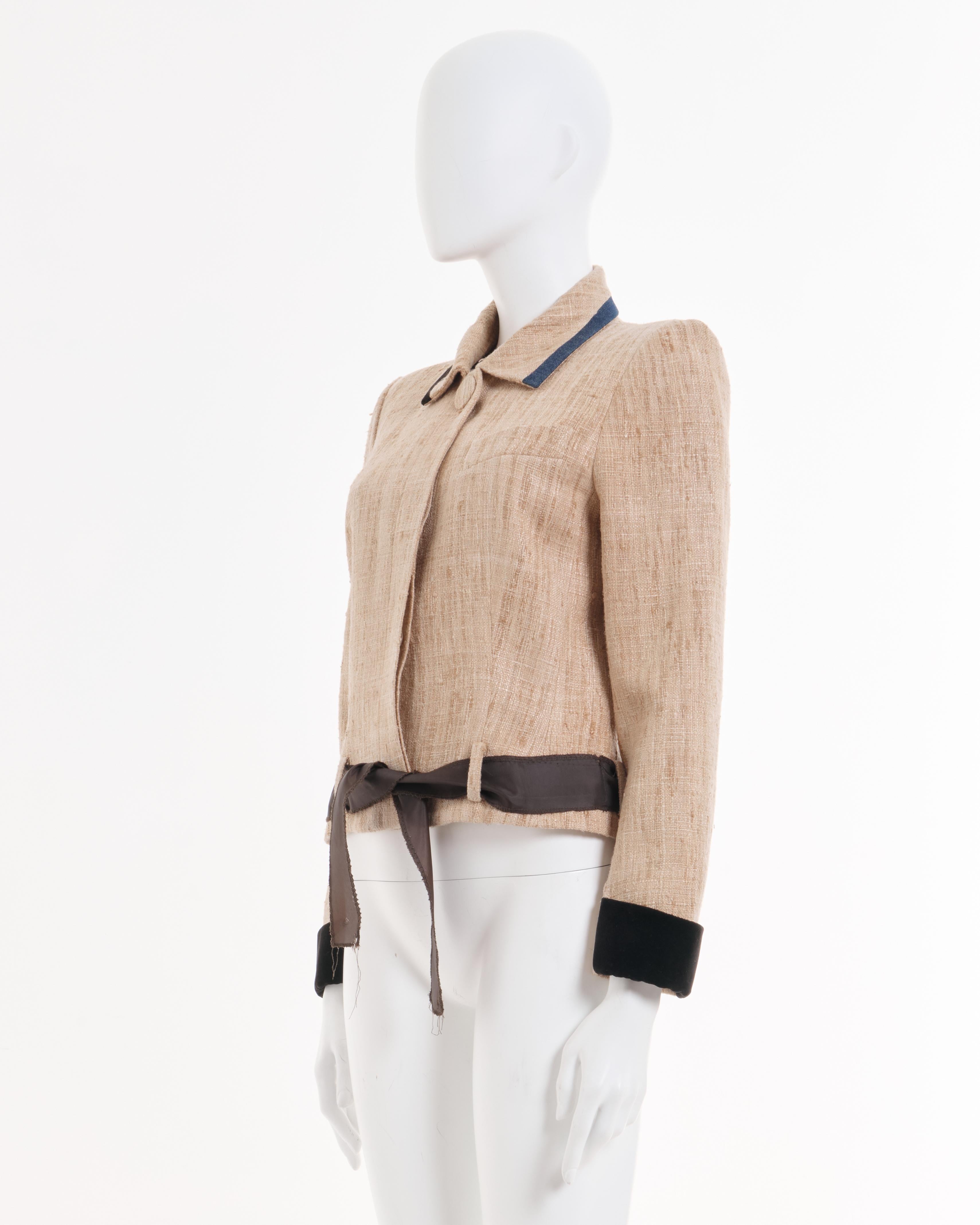 - John Galliano Raw Tan/natural silk trimmed jacket
- Spring Summer 1991 Collection
- Slubby raw silk in tan/natural tones
- Long sleeves are trimmed in dark chocolate brown velvet
- Collar trimmed in velvet and blue denim
- Hidden button placket