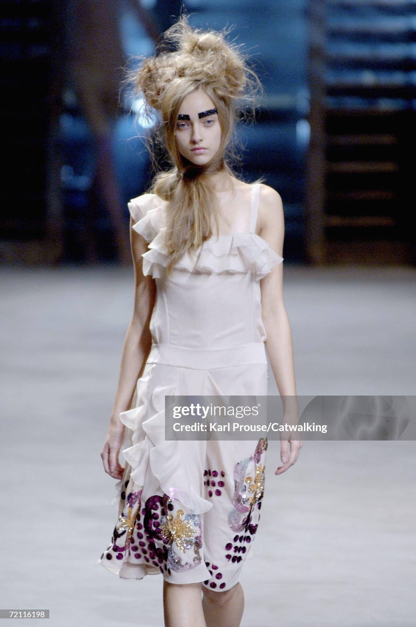- Designed by John Galliano 
- Sold by Skof.Archive
- Spring-Summer 2007 Runway piece
- Pink cocktail dress 
- Asymmetrical straps 
- Rouges and gathers on the bust 
- Side buttons closure, typically by Galliano 
- Different shades of pink sequins