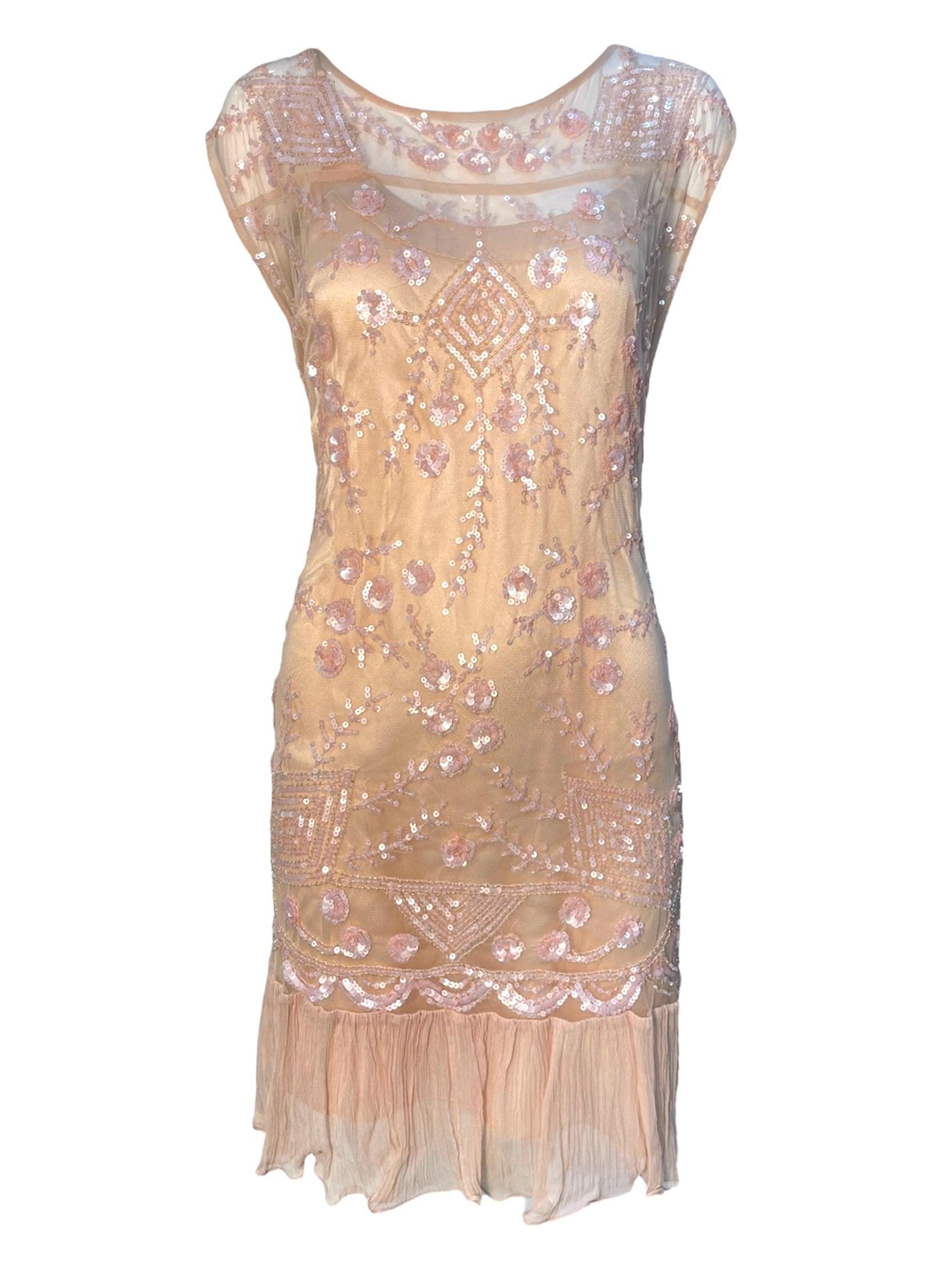De la mente mágica del Sr. Galliano. ¡Suficientemente dulce para comer! De la colección Primavera 2008. Esta pieza es una iteración del también fabuloso vestido fotografiado en la pasarela que hemos incluido en las fotos.
Slip de ballet translúcido