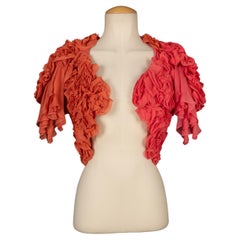 Boléro/veste John Galliano en crêpe de soie dans les tons orange et rose