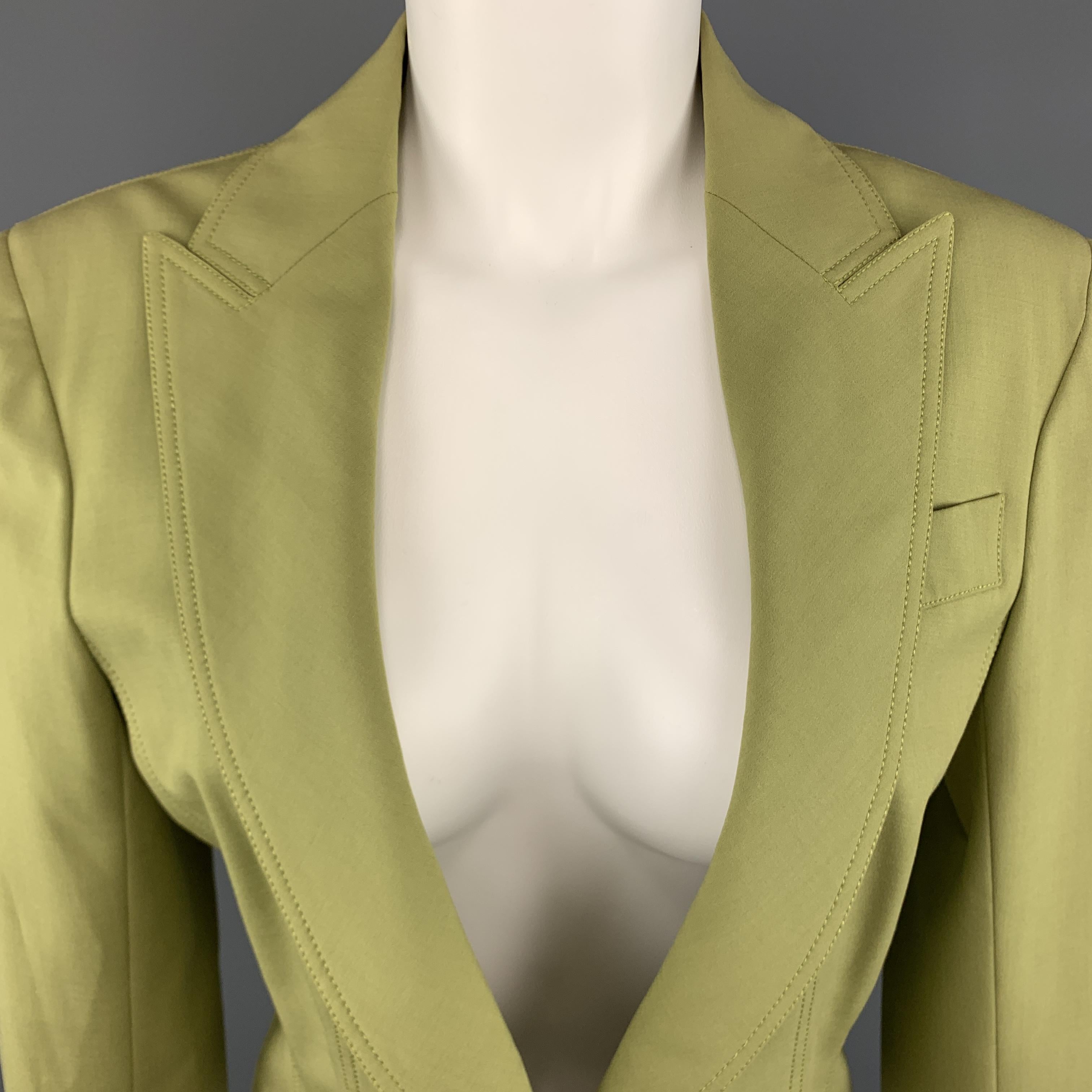 JOHN GALLIANO  Cropped Jacket comes in a green tone in a viscose blend material, with a peak lapel, a deep V-neck, a faux slit pocket, a single button at closure, single breasted. Made in France.
 
Excellent Pre-Owned Condition.
Marked: US 8
