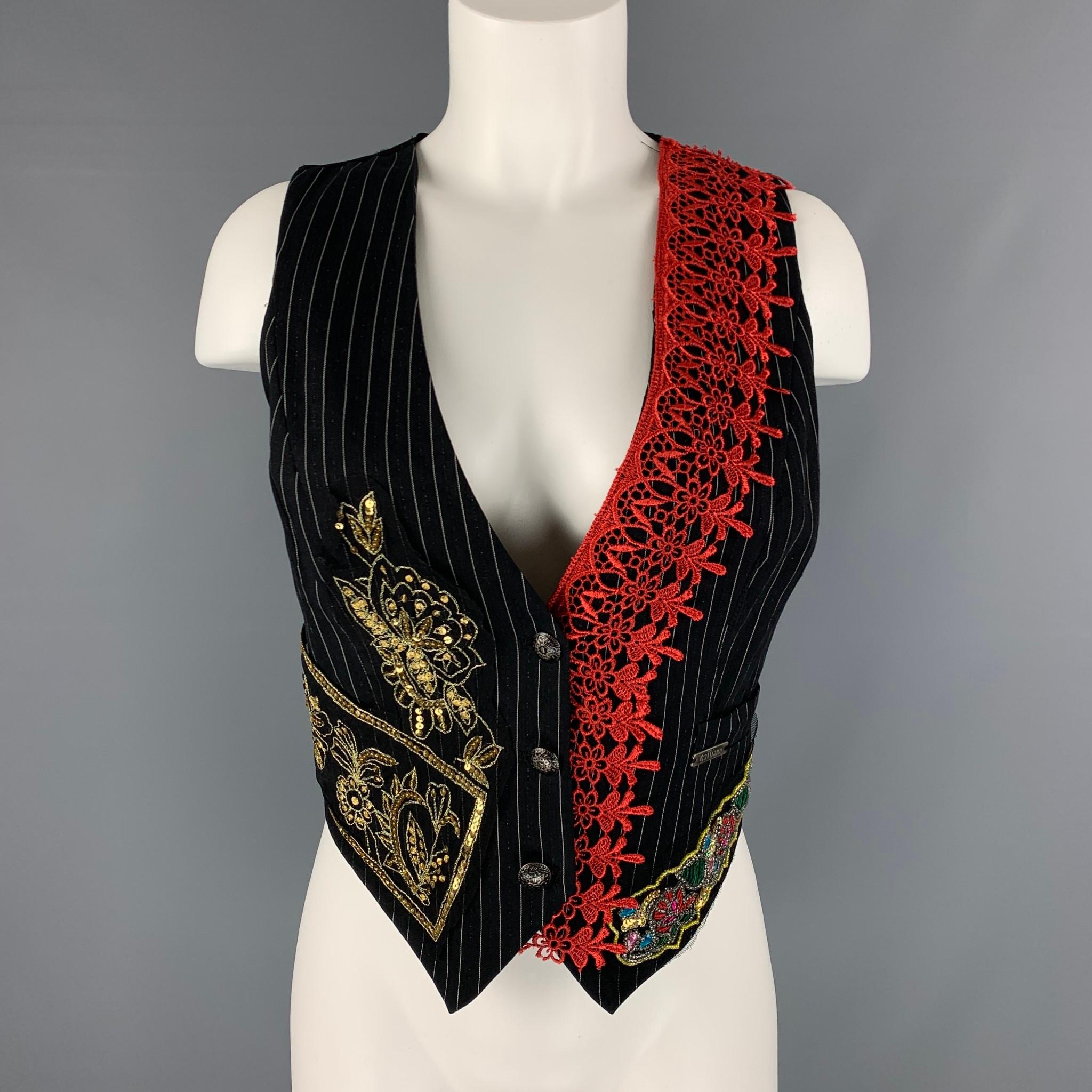 JOHN GALLIANO vest comes in black, red and gold pinstripe fabric with a v-neck, three buttons closure, beaded embroidery detail, newspaper print and lace detail and back belt.

Excellent Pre-Owned Condition.
Marked: no size