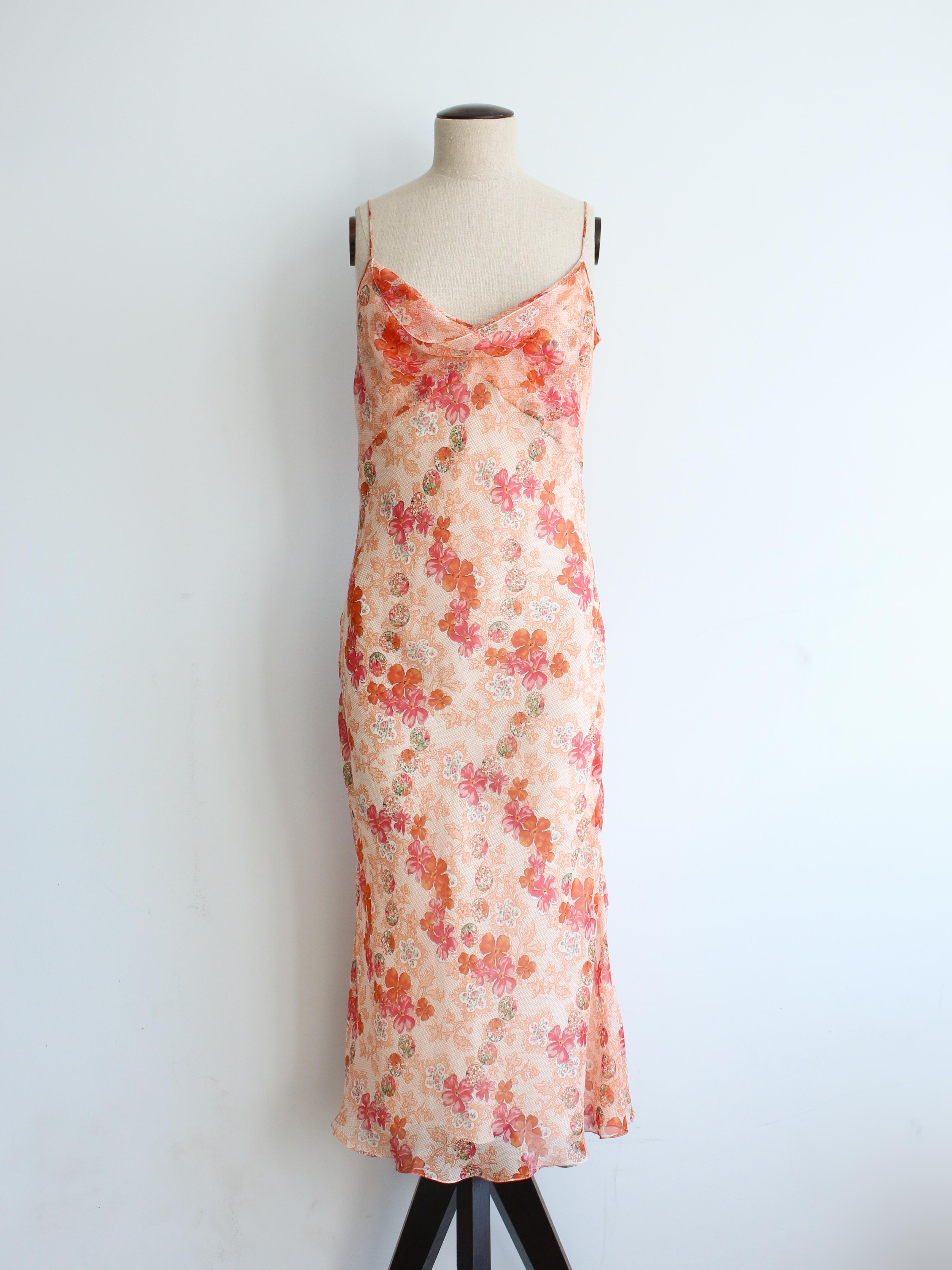 John Galliano Spring/Summer 2006 bias cut silk slip printed with peach and orange florals.

Tagged size FR38.

In excellent condition.