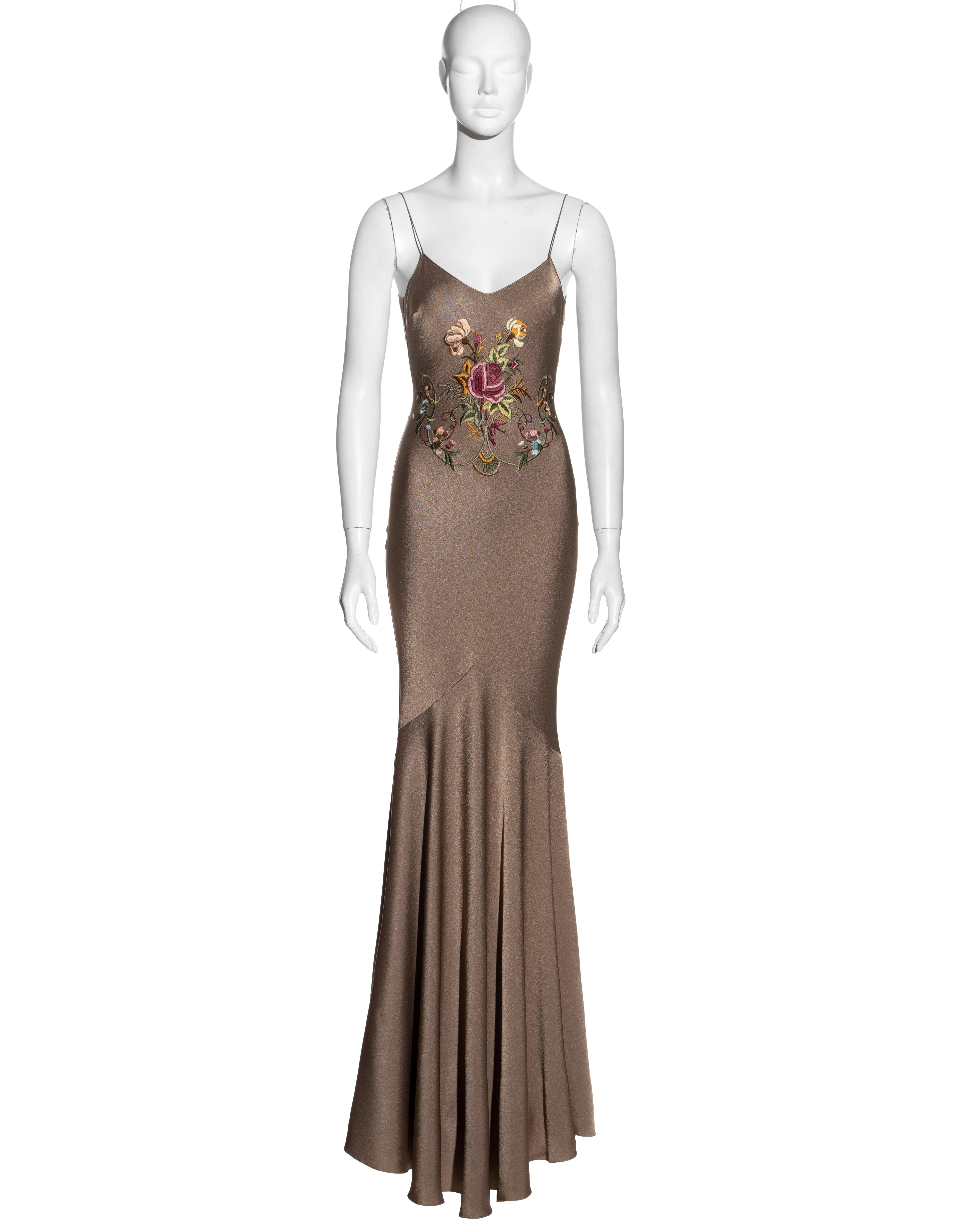 ▪ John Galliano bias-cut evening dress
▪ Taupe crepe-backed satin 
▪ Floral embroidery at the front and back 
▪ Floor-length skirt with train 
▪ Silk trim and spaghetti straps 
▪ Size French 38 
▪ Spring-Summer 2003
▪ 68% Acetate, 32% Viscose  Trim: