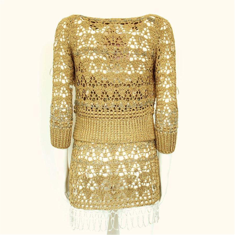 Viscose (66%) Polyester (18%) Poliamid Golden color Perforated Stones and embroidery applied One button closure Length shoulder/hem cm 47 (18.5 inches)
