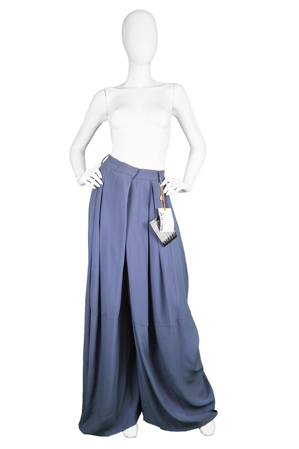 An incredible and avant garde women's or men's pair of John Galliano palazzo pants. In a blue crepe with an ultra wide leg that is pleated at the top to give an even more dramatic, voluminous look which looks like a maxi skirt until the wearer's