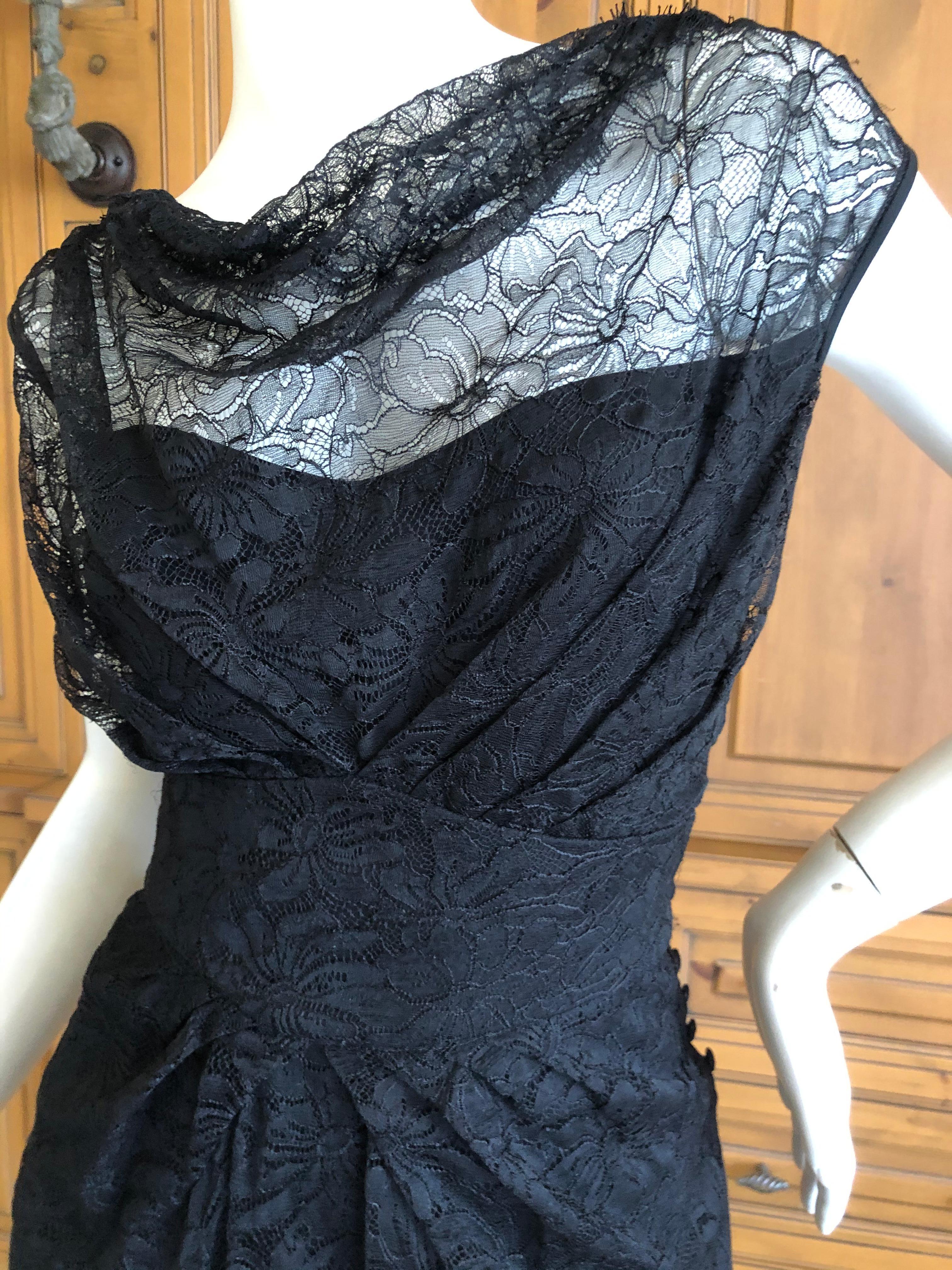 John Galliano Vintage Sleeveless Black Lace Evening Dress
This is so pretty but difficult to photograph the black details.
The lace is so pretty, I also show it raised on the skirt.
 Size 40
 Bust 40