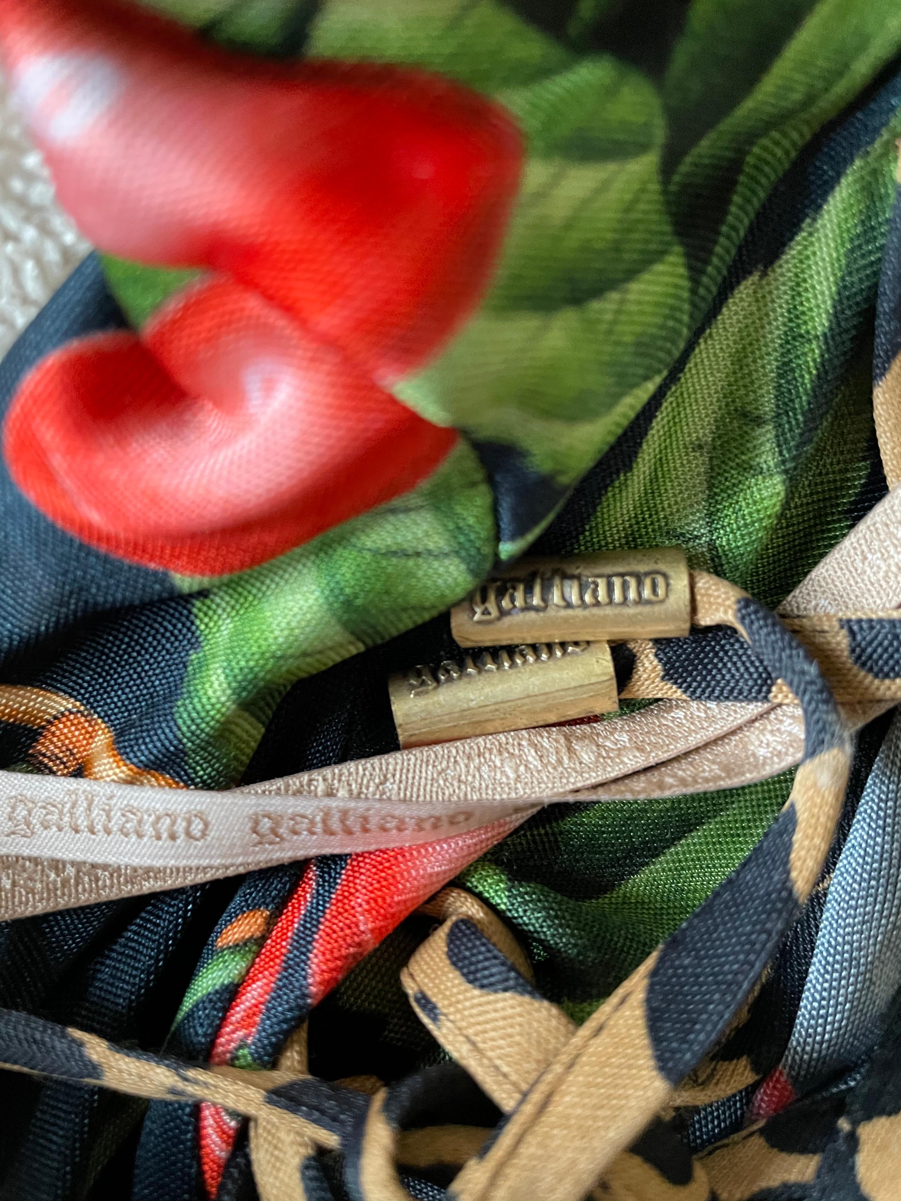 John Galliano Vintage Cherry Print Dress with Leopard Print Details.
The John Galliano rubber label has fallen off, and is no longer on the dress.
No fabric or brand label.
Size 40
Bust 38