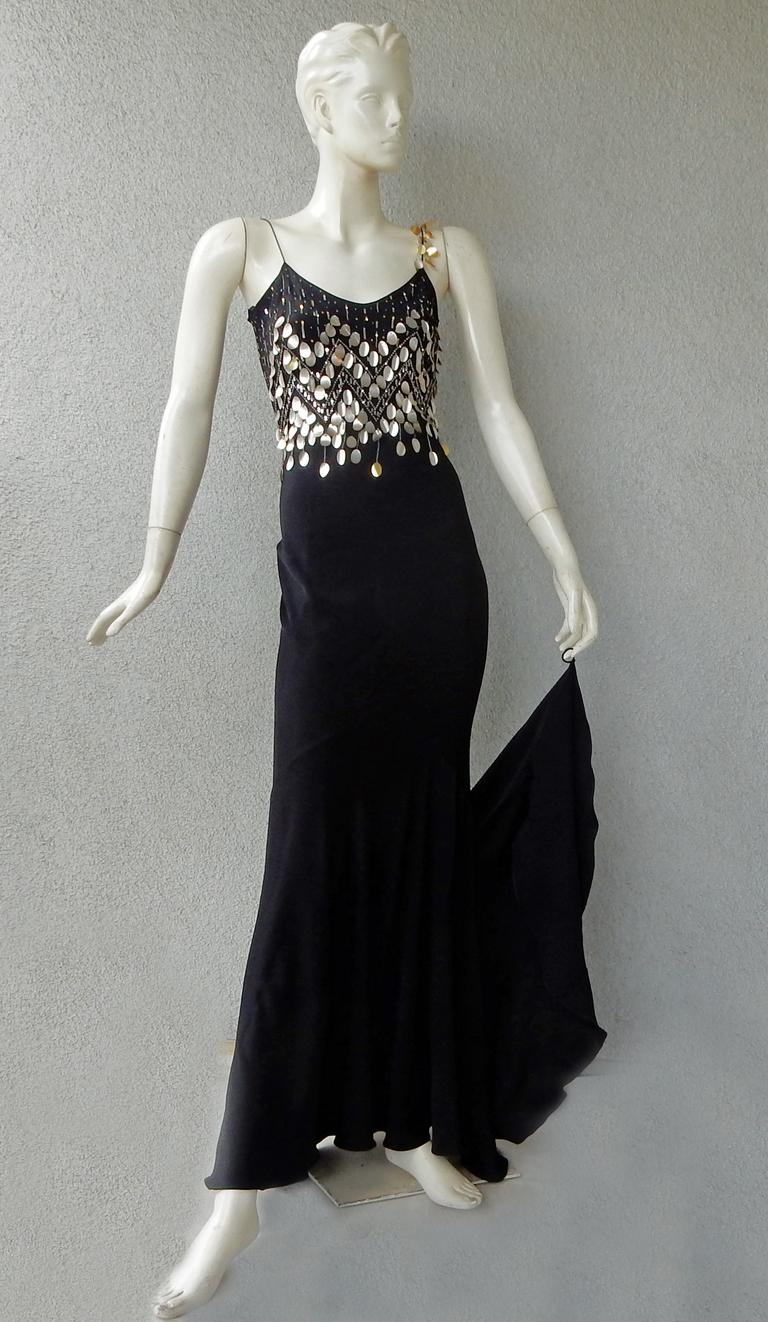 John Galliano vintage 2003 bias cut gown adorned with a shower of hand sewn pale gold circular paillettes and tiny sequins in an inverted diamond pattern.  Scoop neck bodice. Features spaghetti straps with single embellished strap. Dramatic train. 
